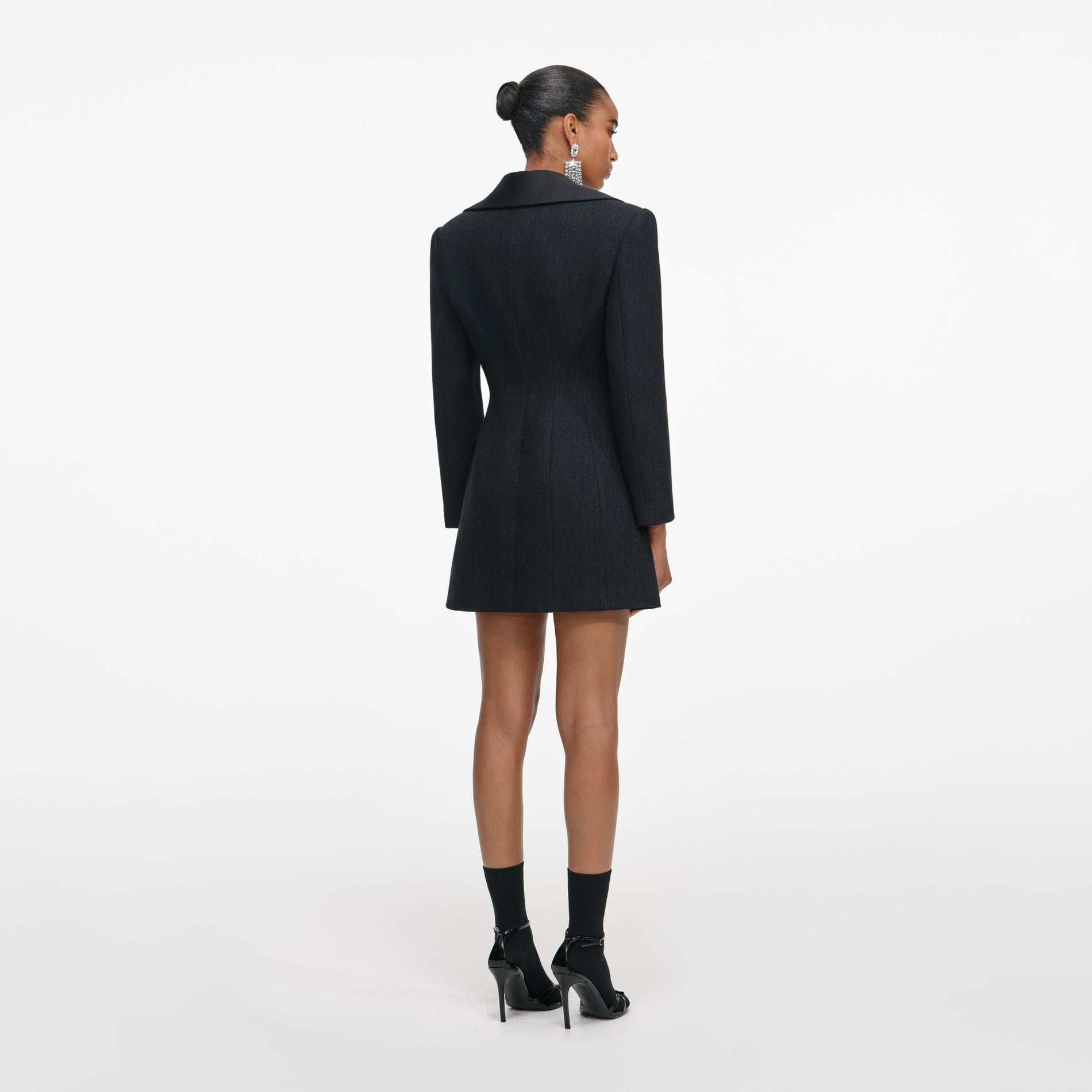 Back view of a woman wearing the Black Blazer Mini Dress