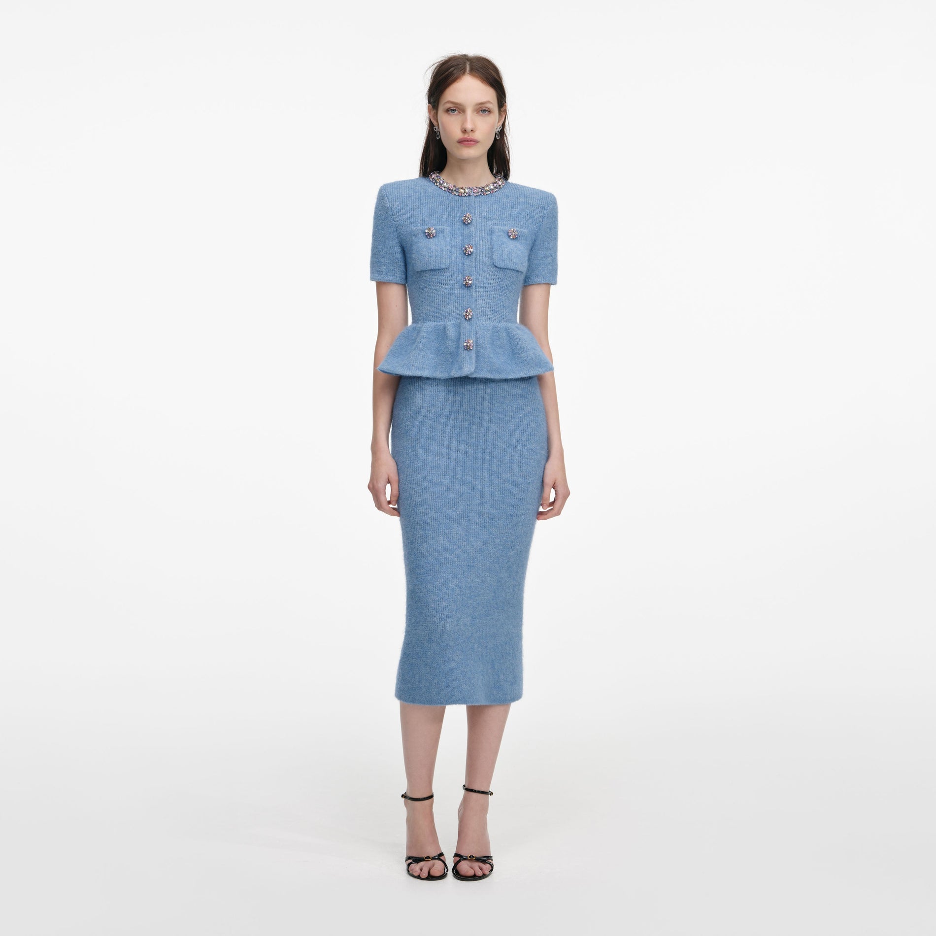Front view of a woman wearing the Blue Peplum Knit Midi Dress