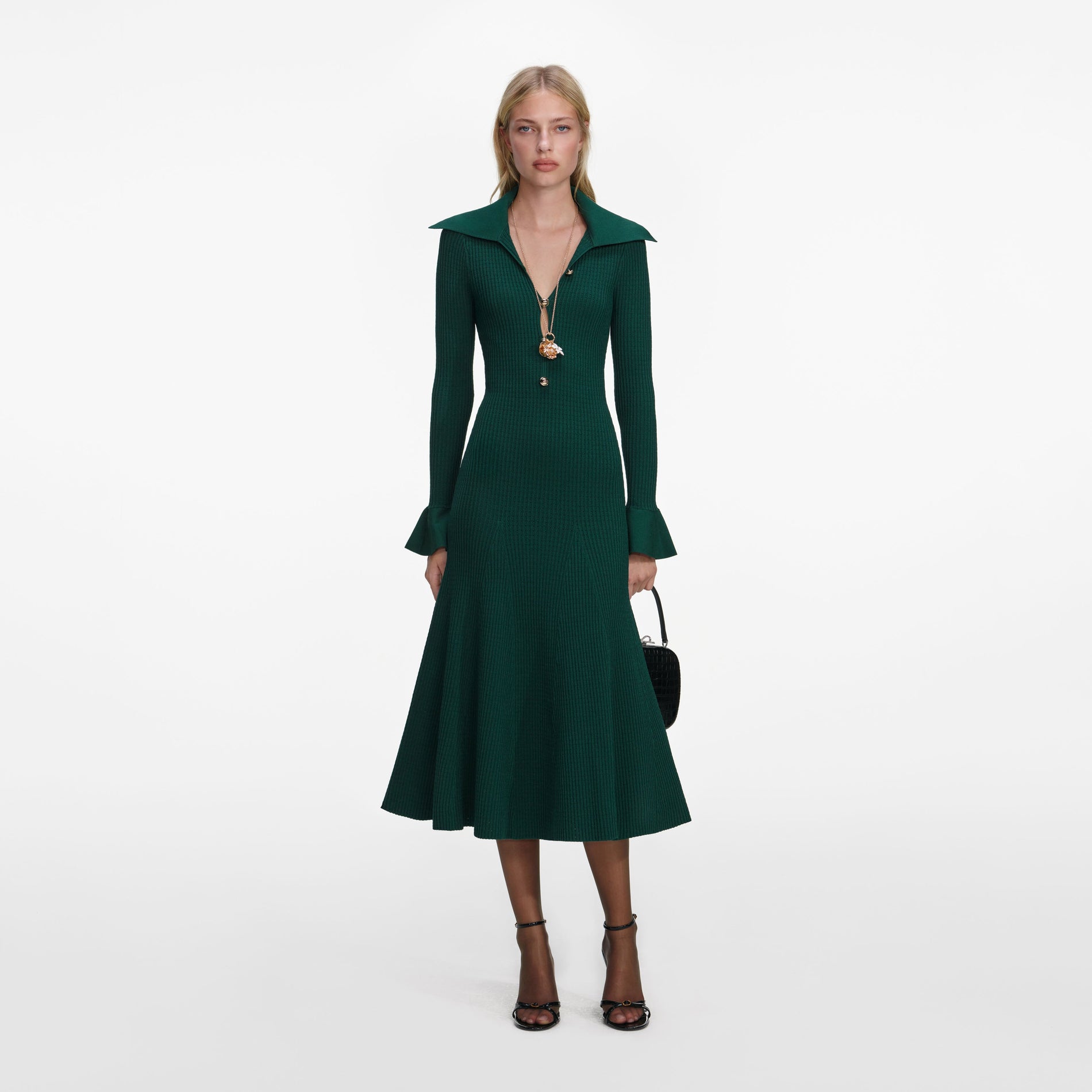 Front view of a woman wearing the Green Keyhole Knit Midi Dress