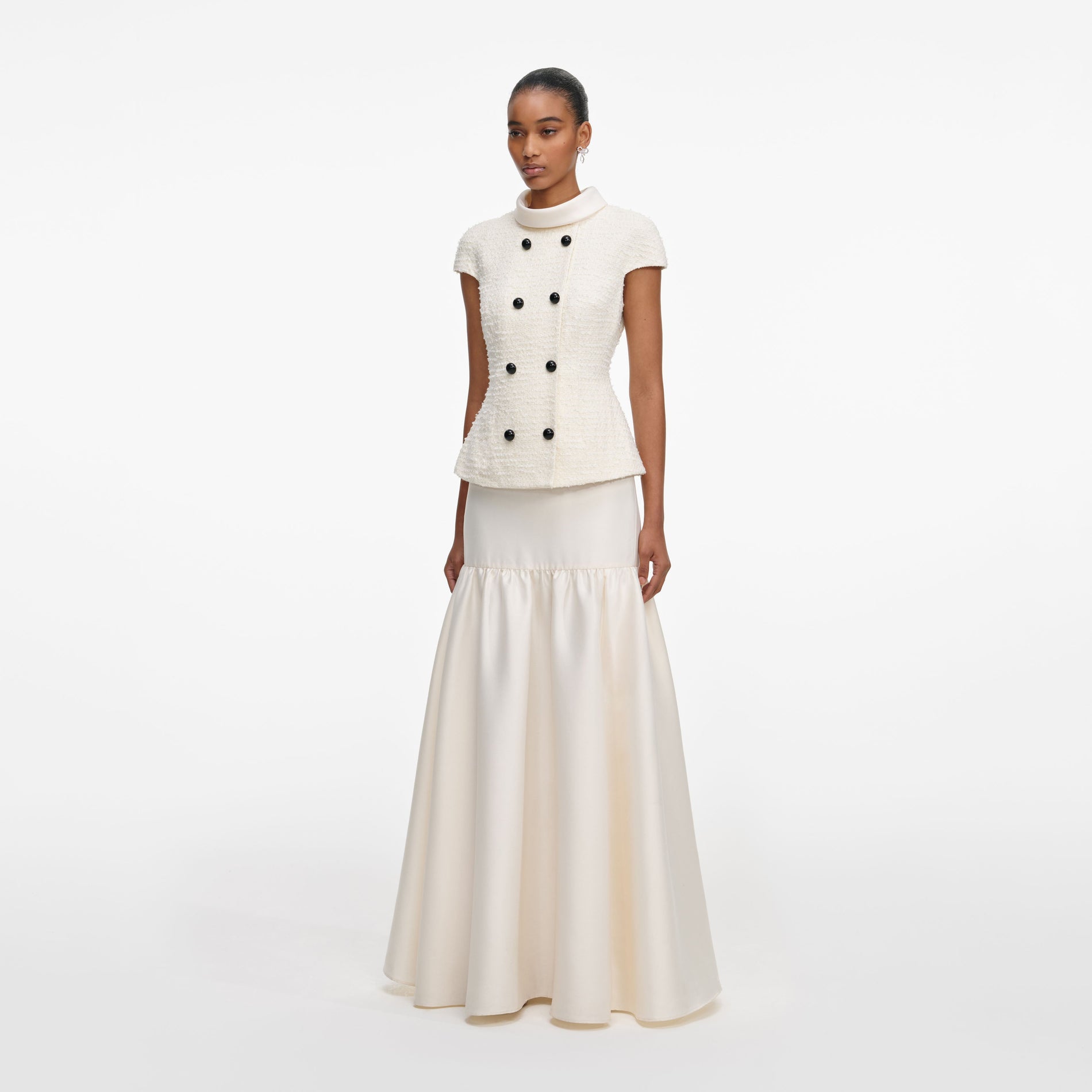 Side view of a woman wearing the Cream Boucle Taffeta Maxi Dress