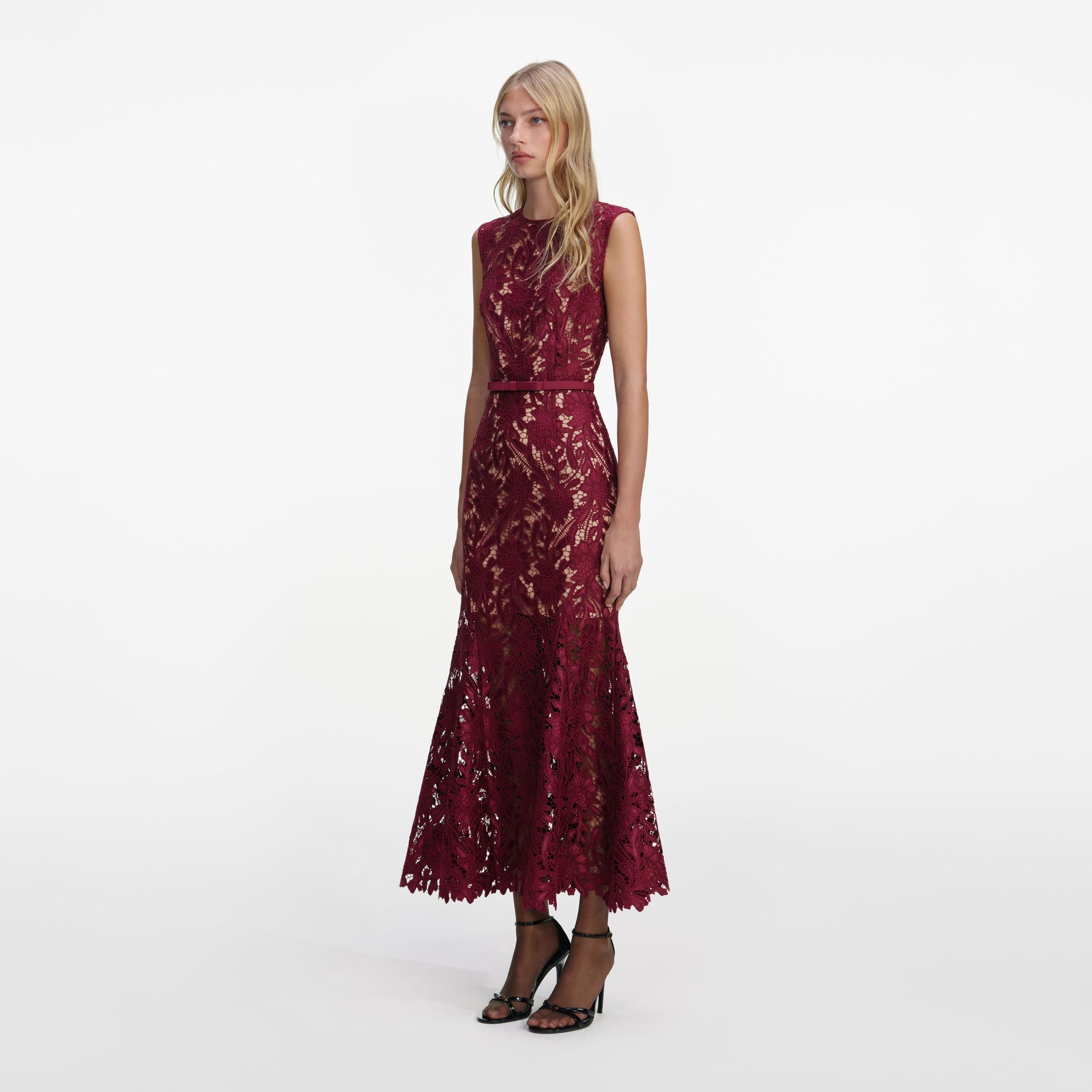 Side view of a woman wearing the Burgundy Guipure Lace Midi Dress