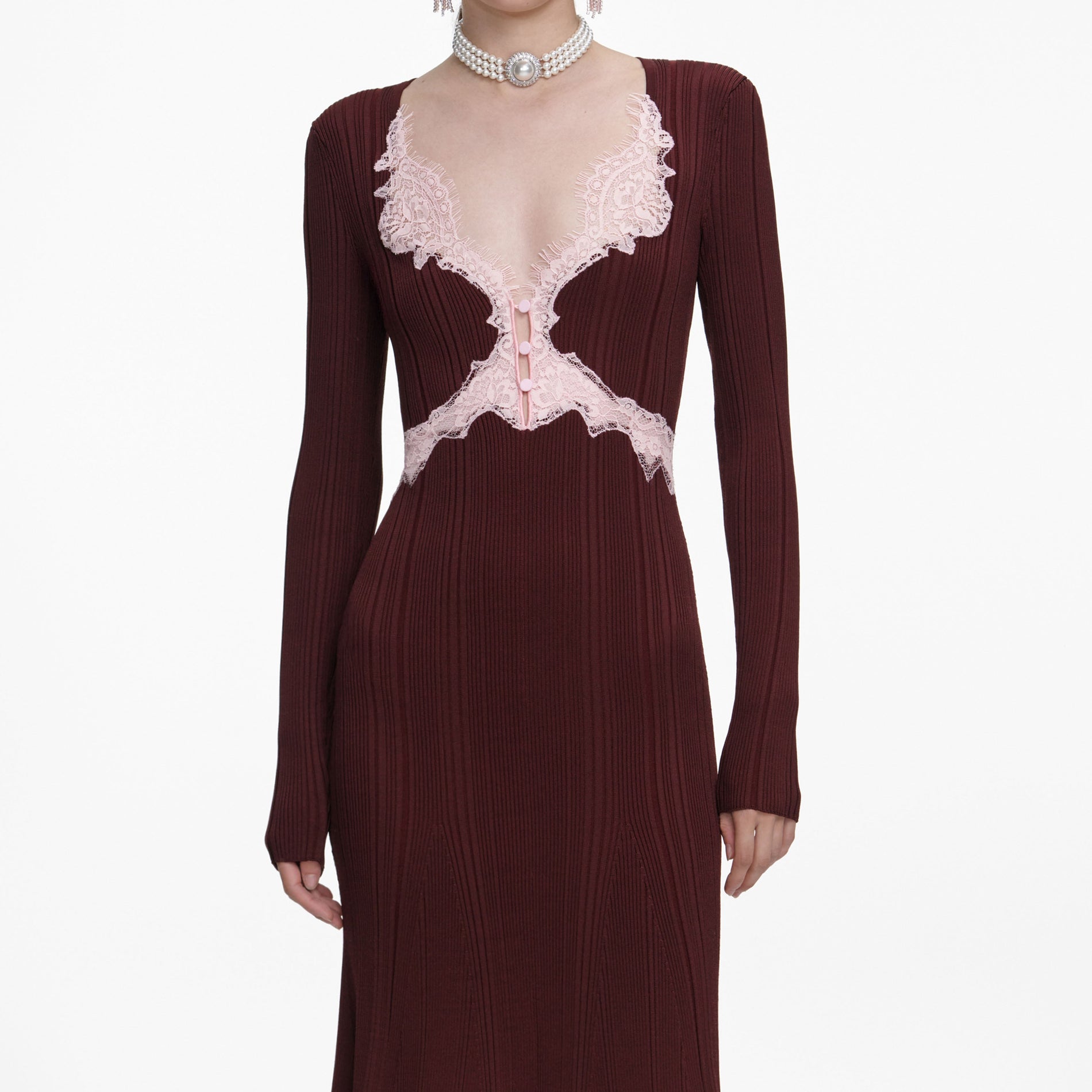 A close up of a woman wearing the Brown Contrast Lace Knit Midi Dress