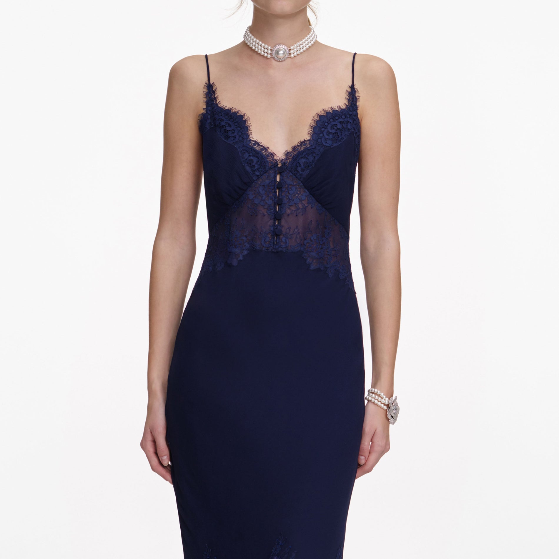 A close up of a woman wearing the Navy Lace Georgette Maxi Dress