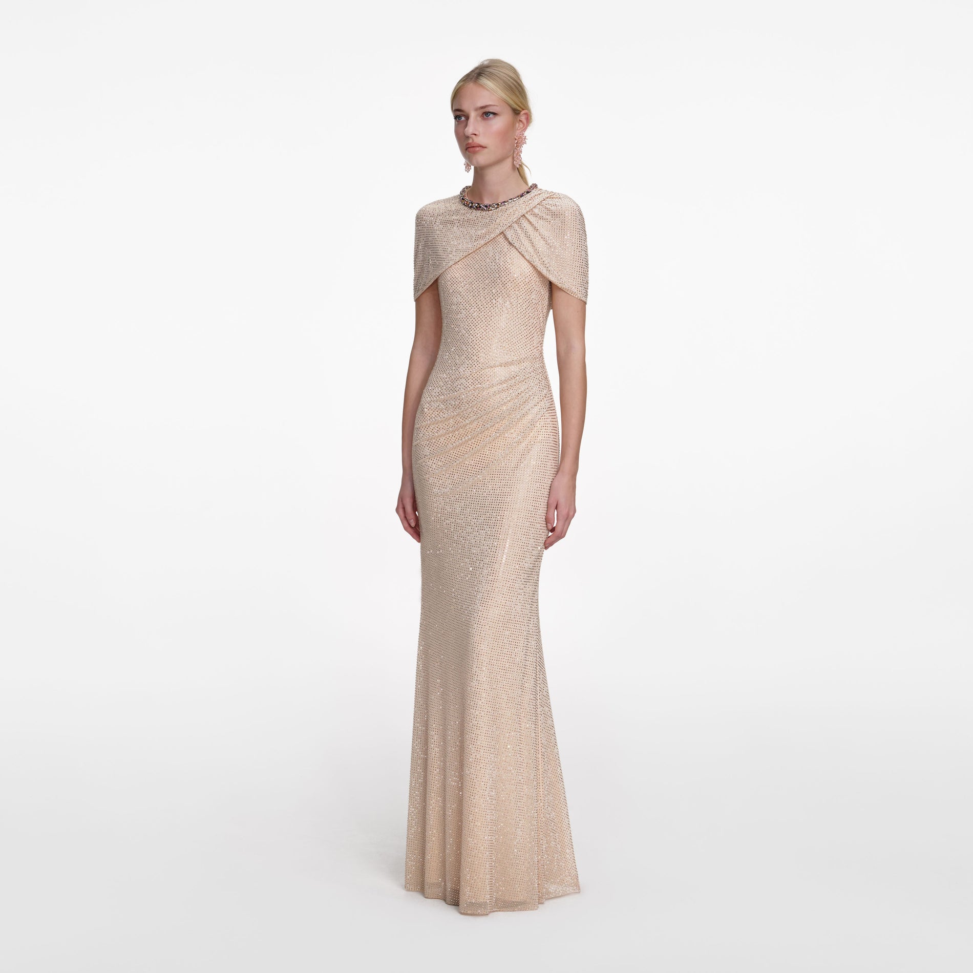 Side view of a woman wearing the Champagne Rhinestone Maxi Dress