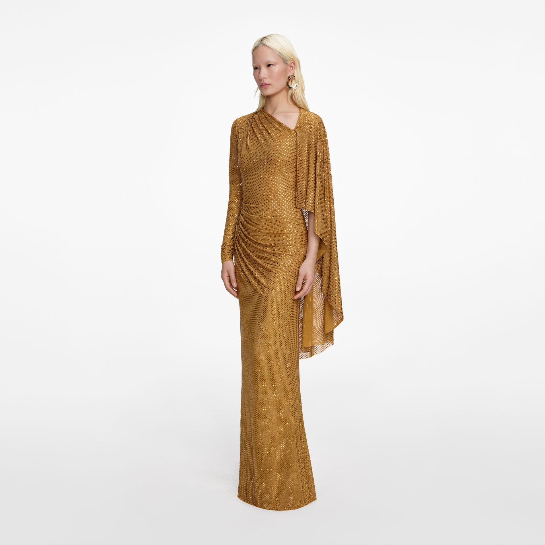 Side view of a woman wearing the Gold Rhinestone Drape Maxi Dress