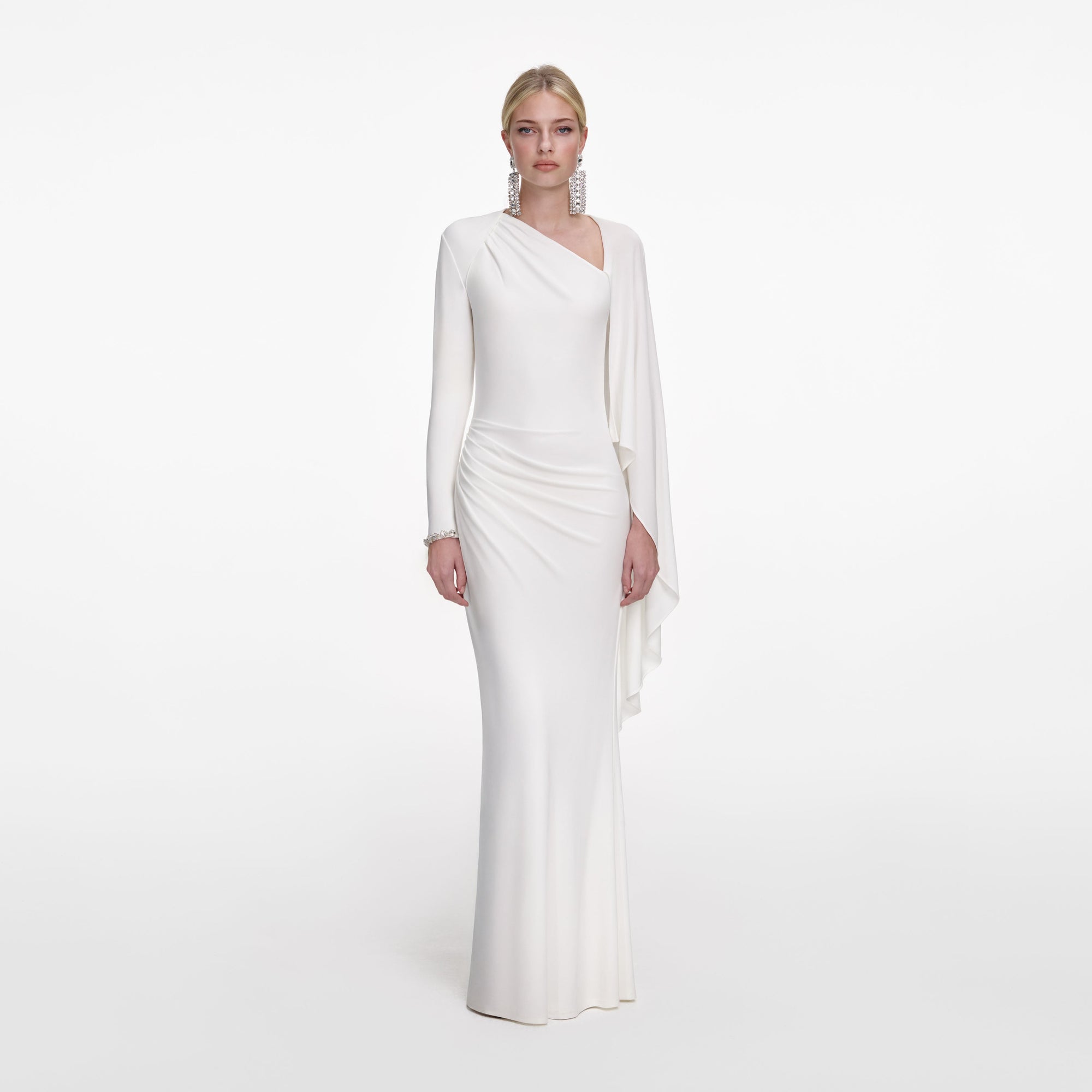 Front view of a woman wearing the White Jersey Drape Maxi Dress