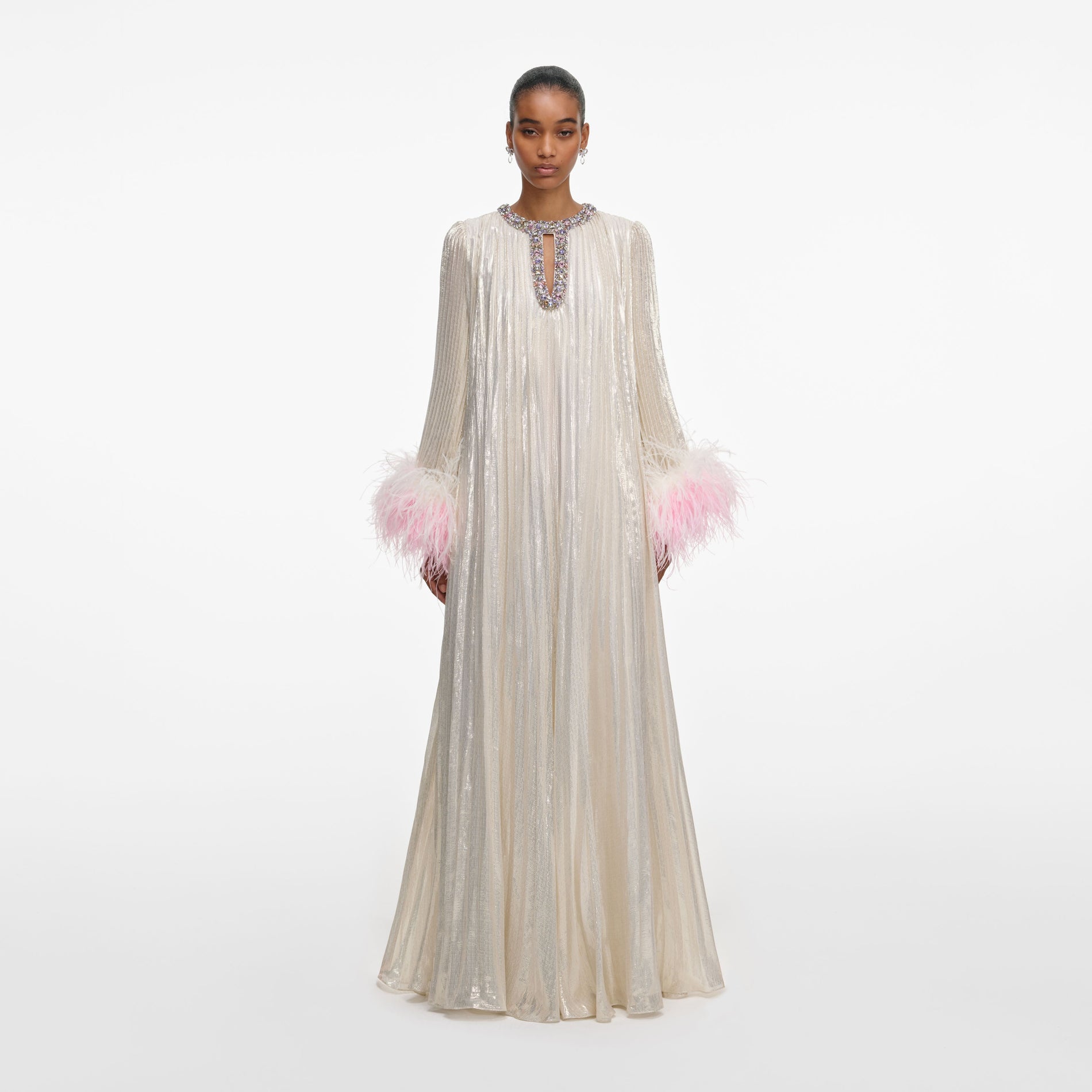 Front view of a woman wearing the Champagne Metallic Ombre Feather Maxi Dress