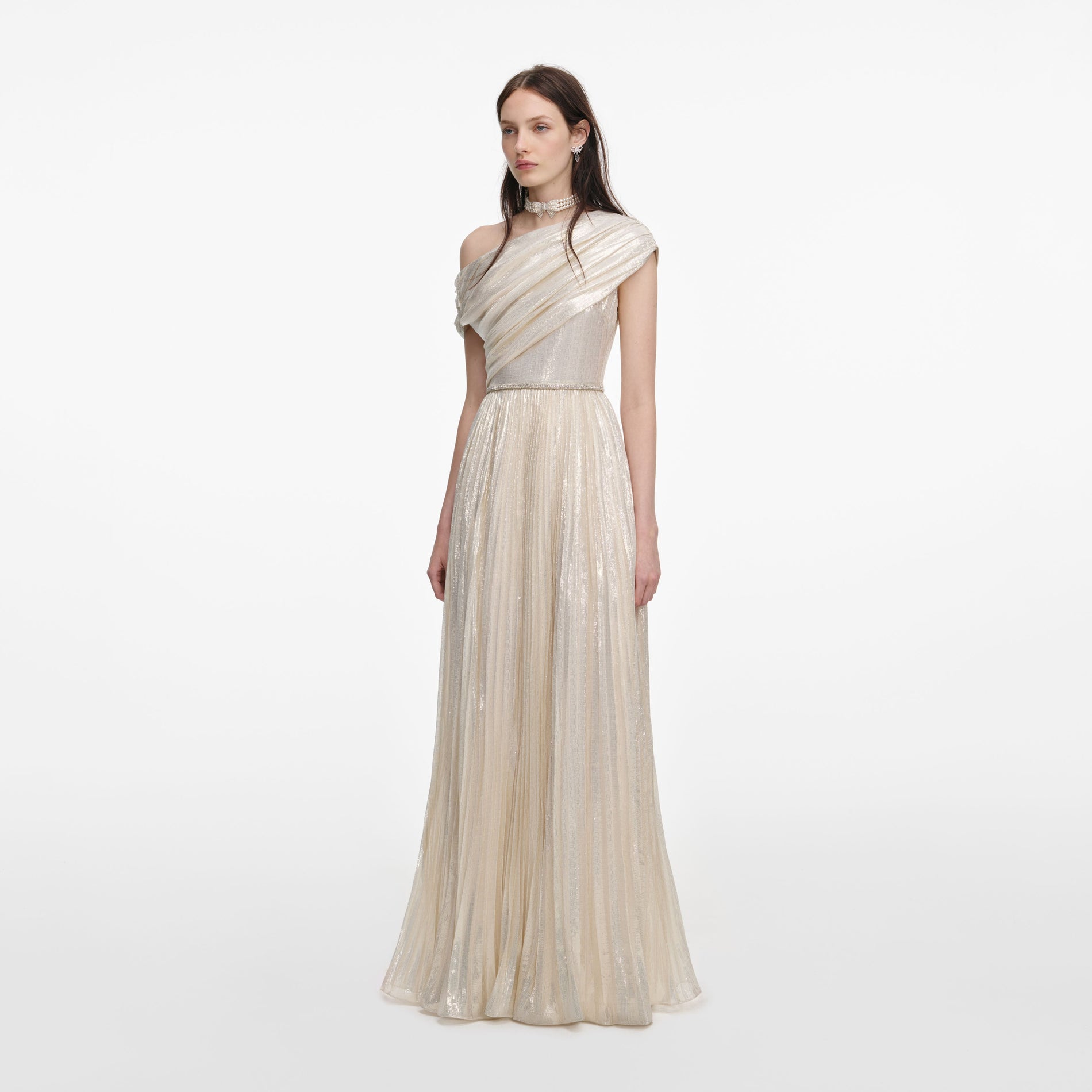 Side view of a woman wearing the Champagne Metallic Chiffon Maxi Dress
