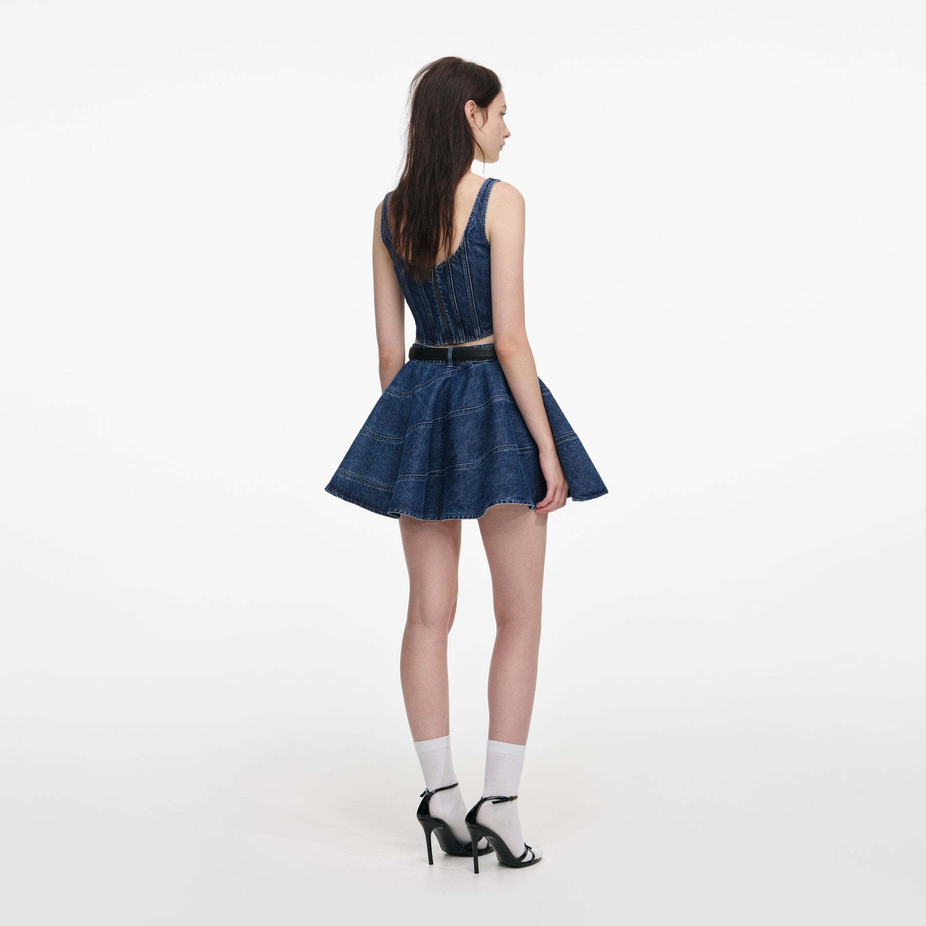 Back view of a woman wearing the Denim Corset Top