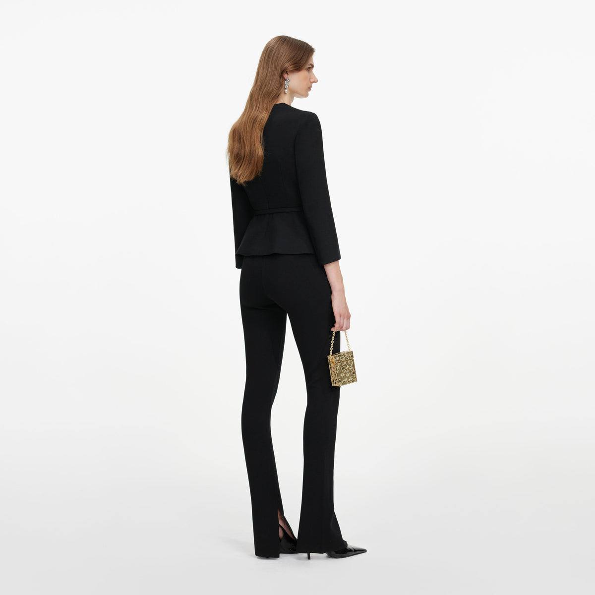 Back view of a woman wearing the Black Tailored Brooch Top