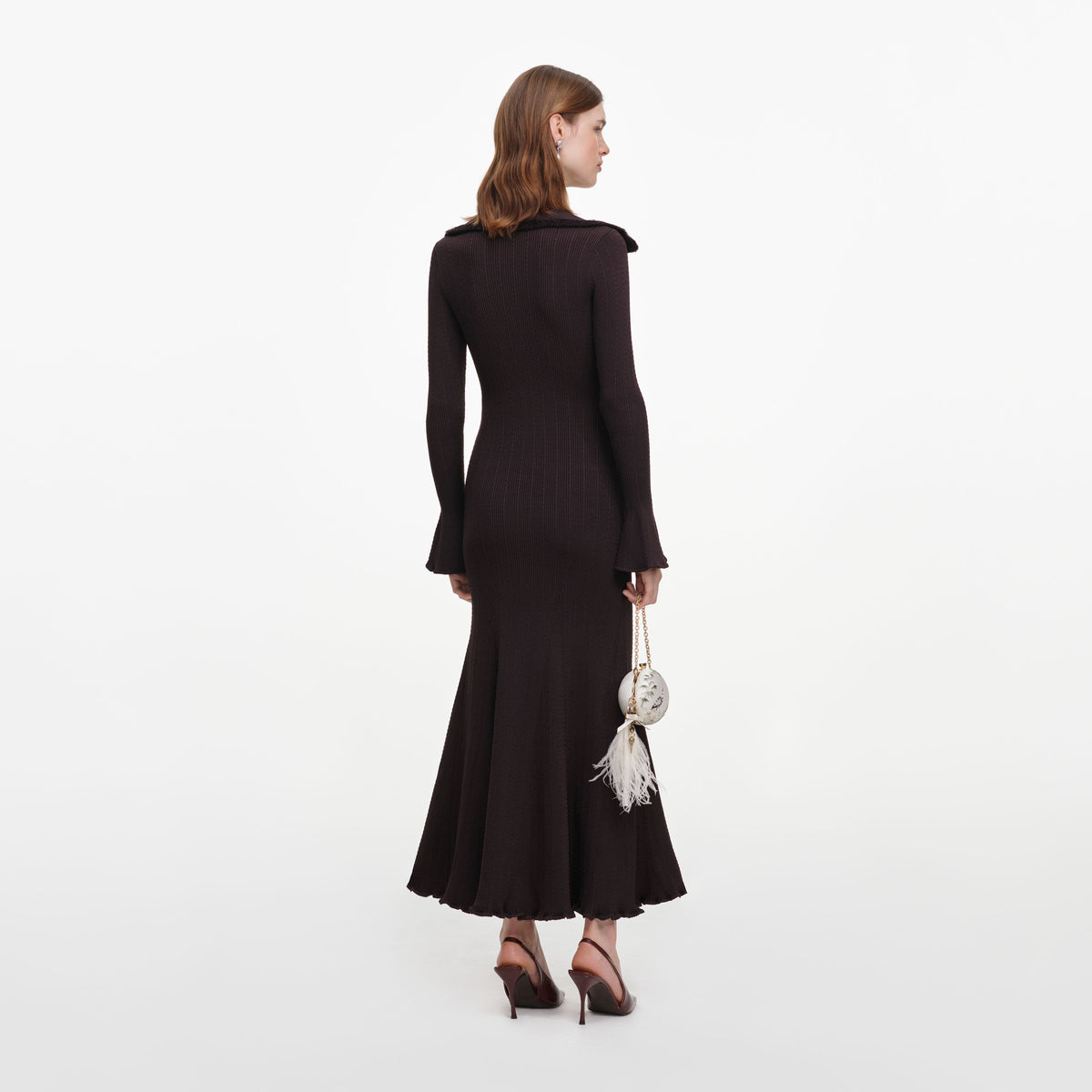 Back view of a woman wearing the Brown Fringe Knit Midi Dress
