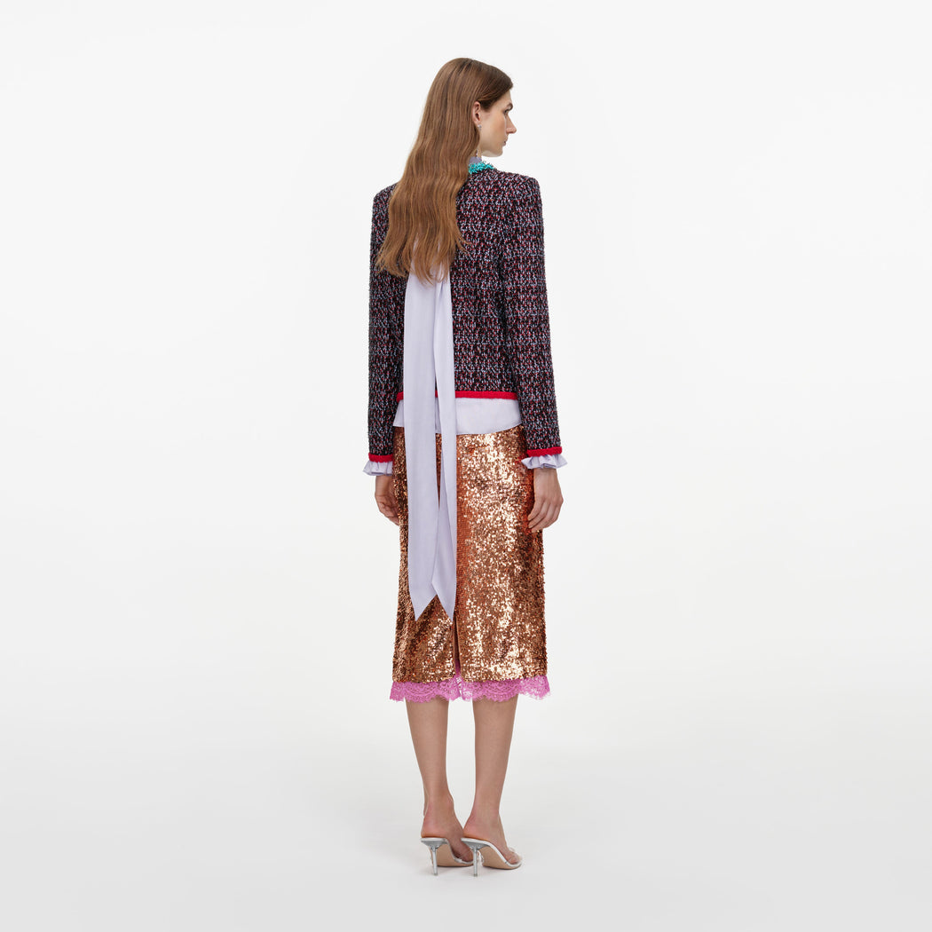 Back view of a woman wearing the Multi Textured Knit Cardigan