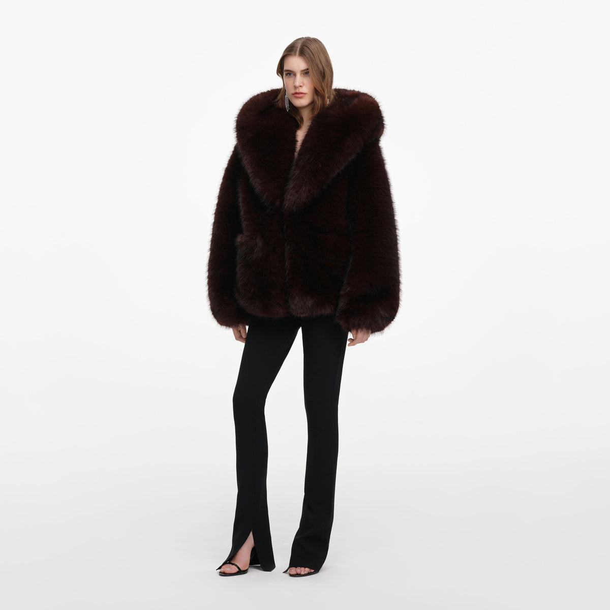 Side view of a woman wearing the Brown Faux Fur Hooded Jacket