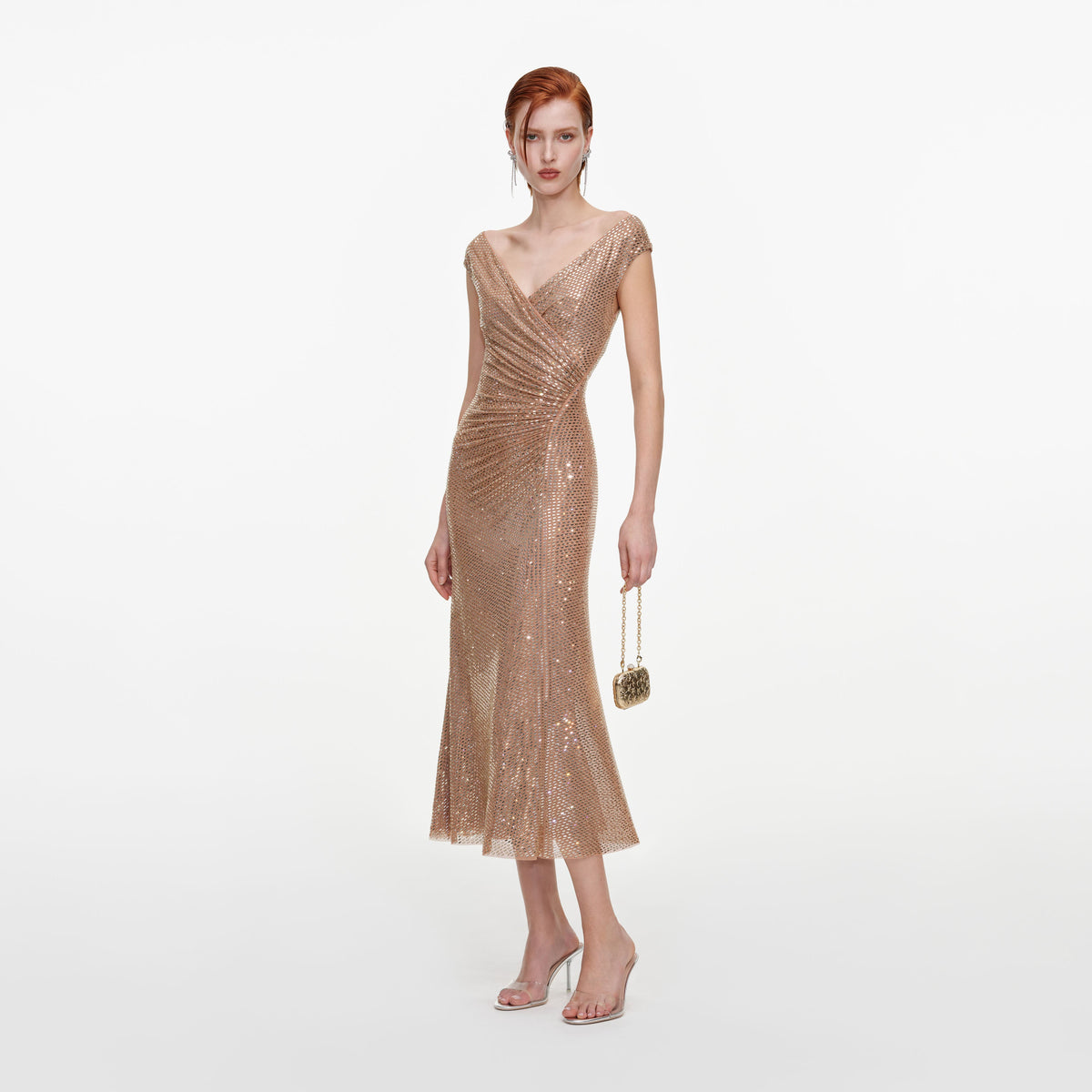 Side view of a woman wearing the Gold Rhinestone Off Shoulder Midi Dress