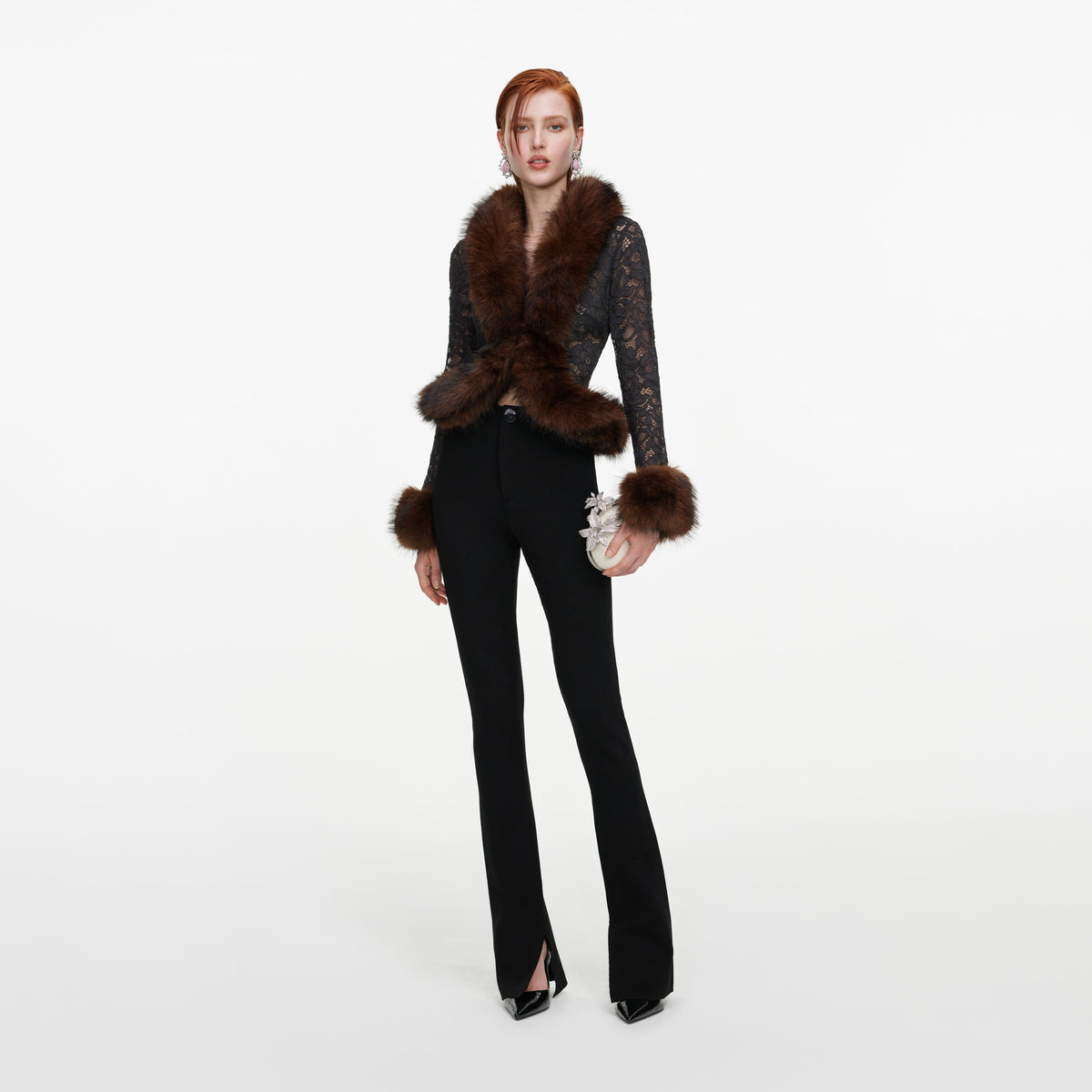 Front view of a woman wearing the Black Flared Knit Trousers
