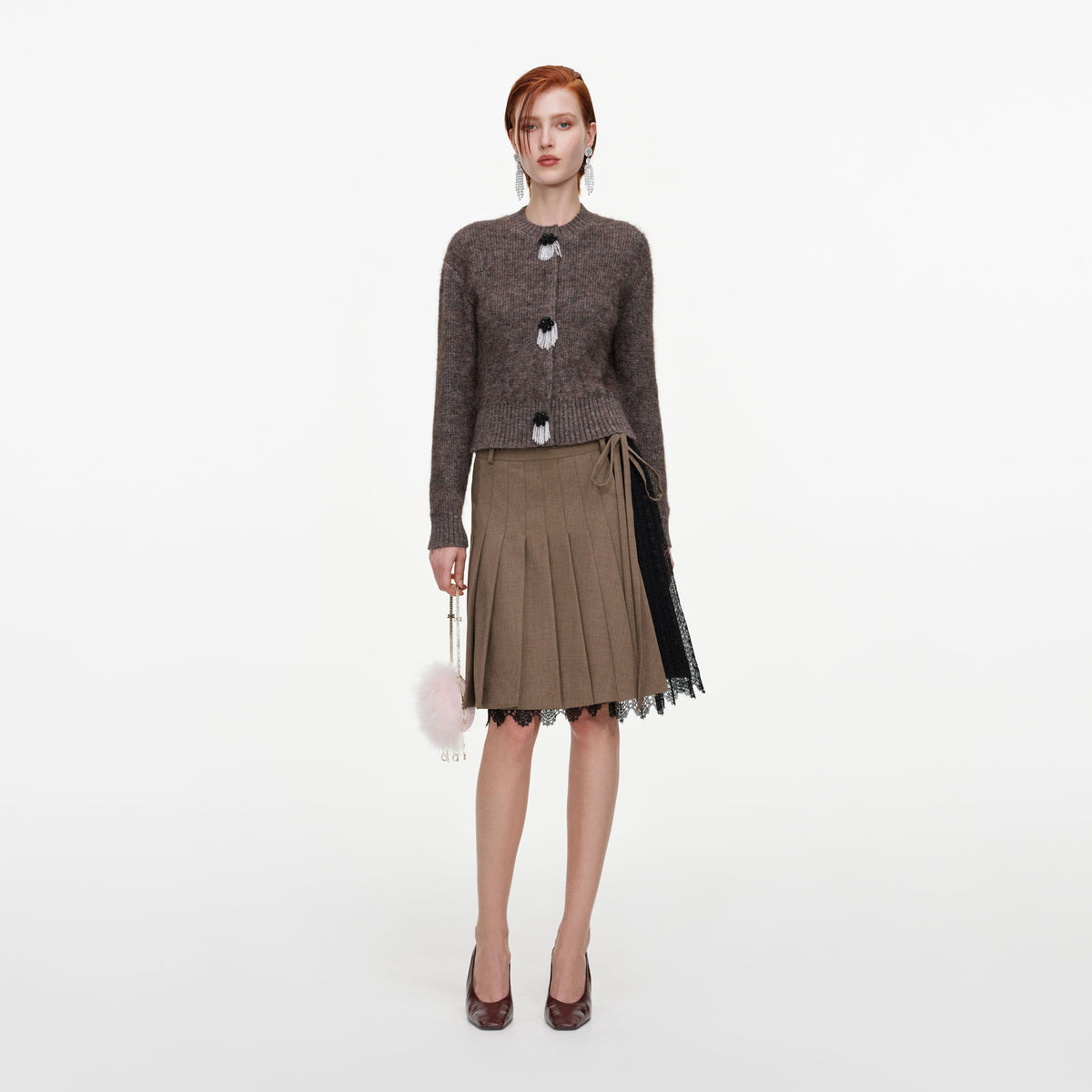 Front view of a woman wearing the Brown Twill Lace Pleated Midi Skirt