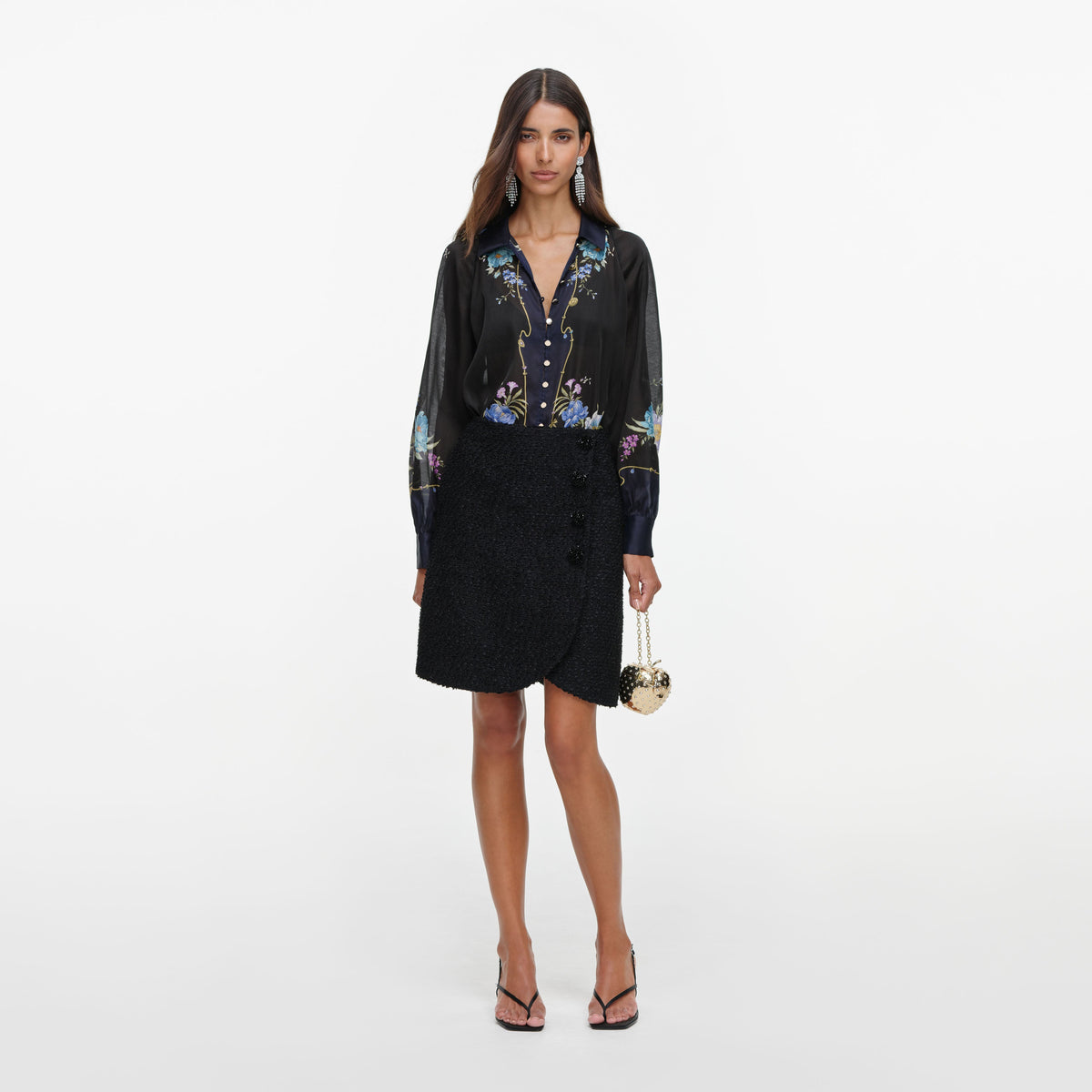 Front view of a woman wearing the Navy Floral Organza Blouse