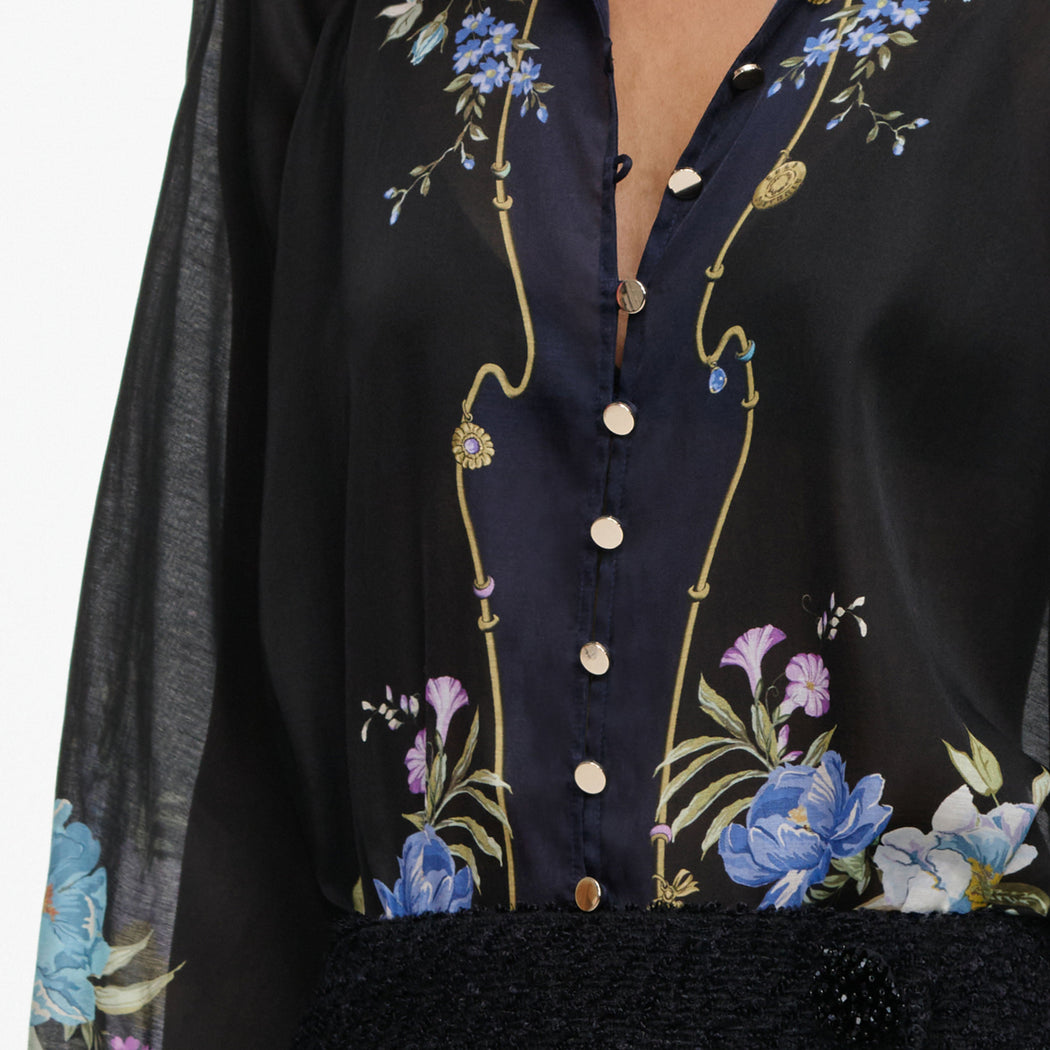 A close up of the fabric for the Navy Floral Organza Blouse