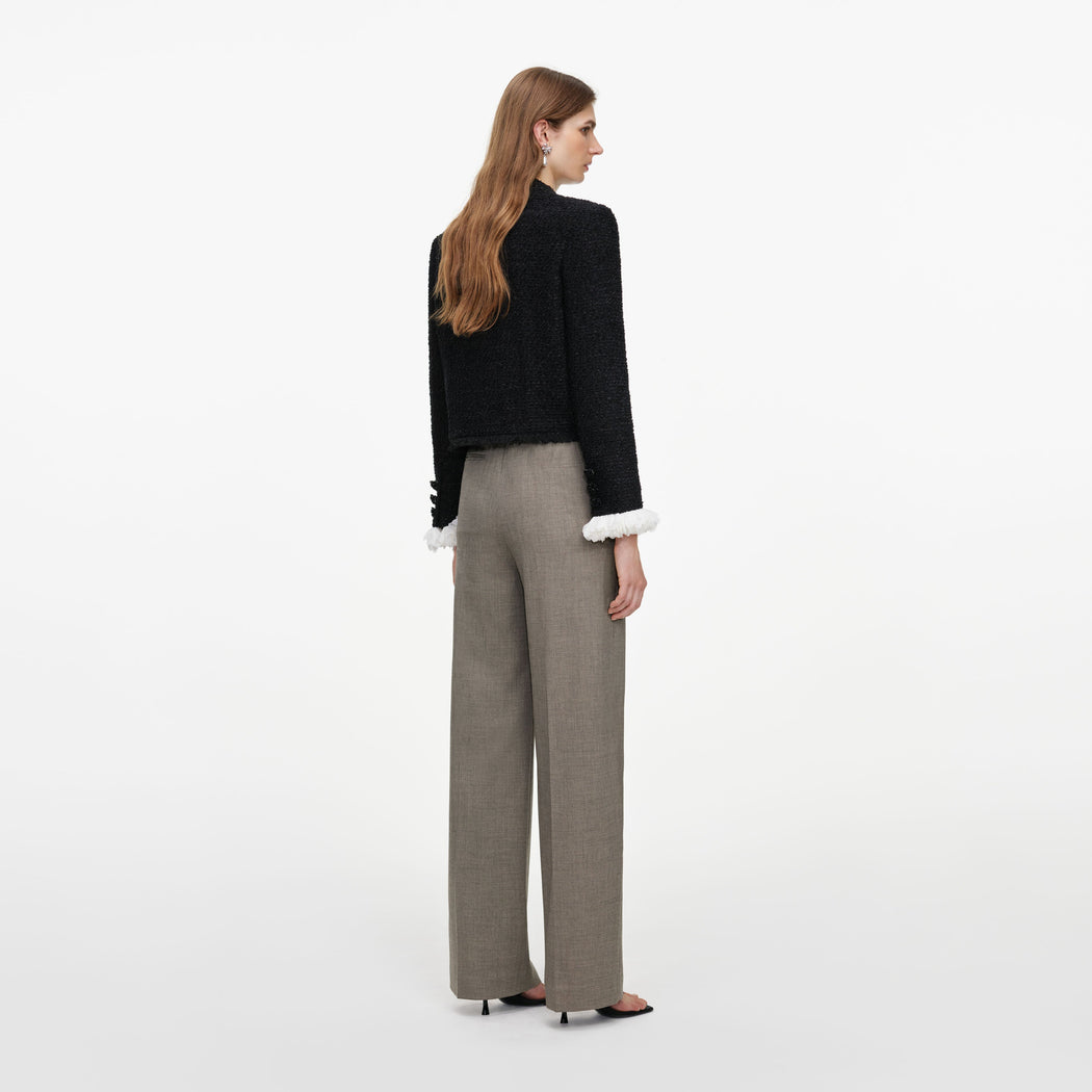 Back view of a woman wearing the Brown Twill Tailored Trousers