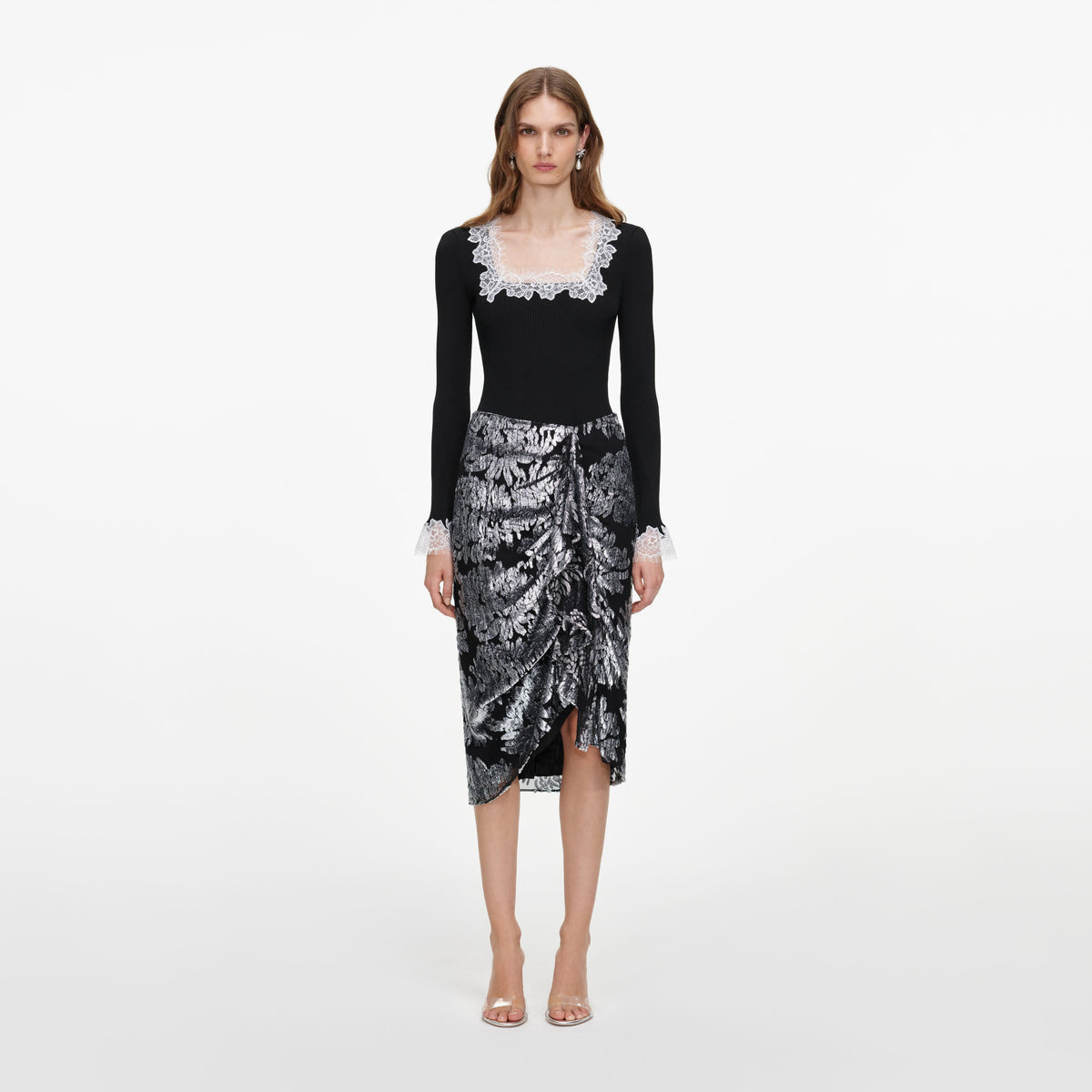 Front view of a woman wearing the Silver Fil Coupe Midi Skirt