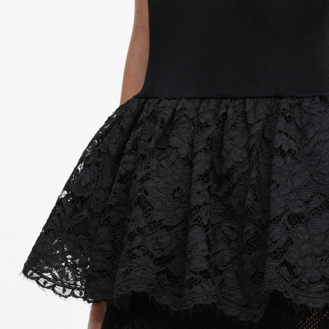 A close up of the fabric for the Black Peplum Viscose Knit Top