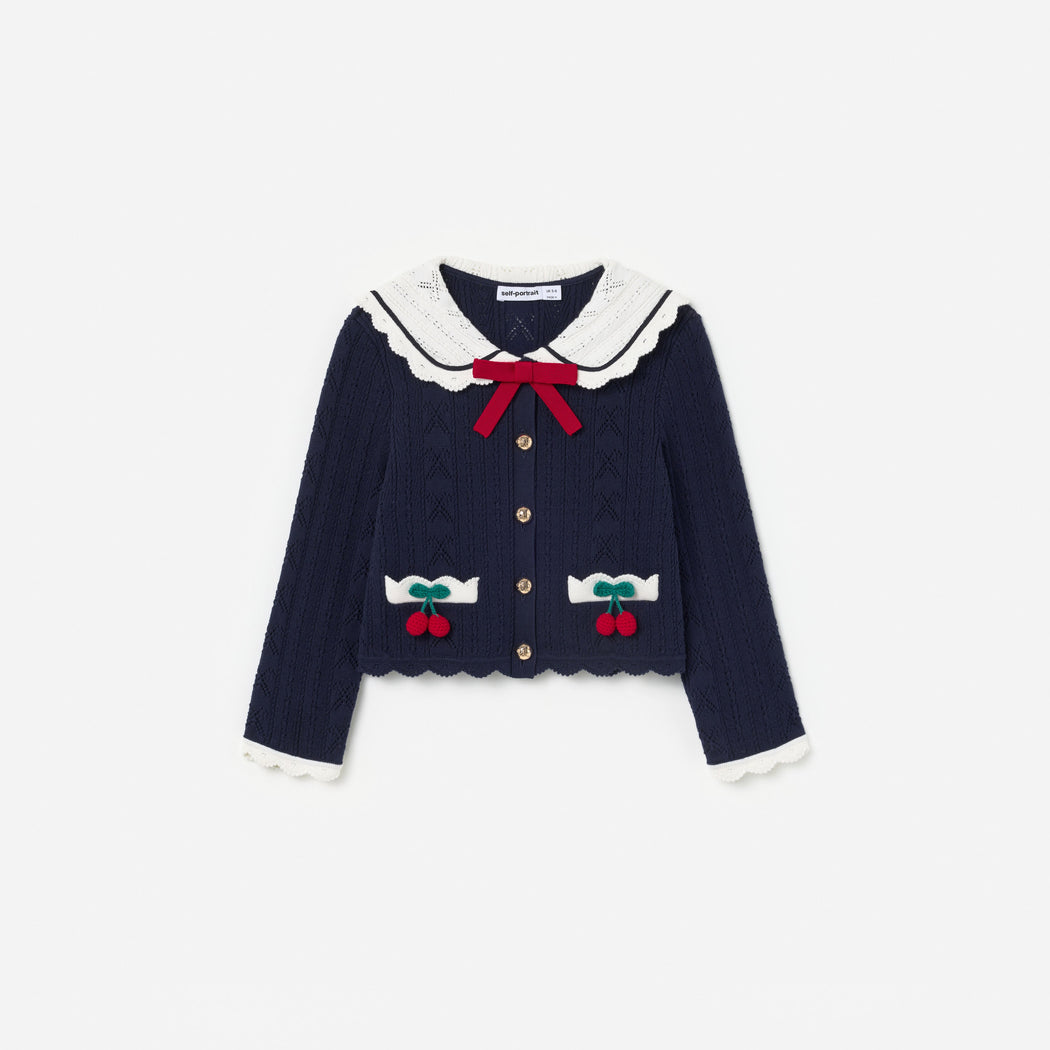 Front view of a girl wearing the Navy Pointelle Knit Cherry Cardigan