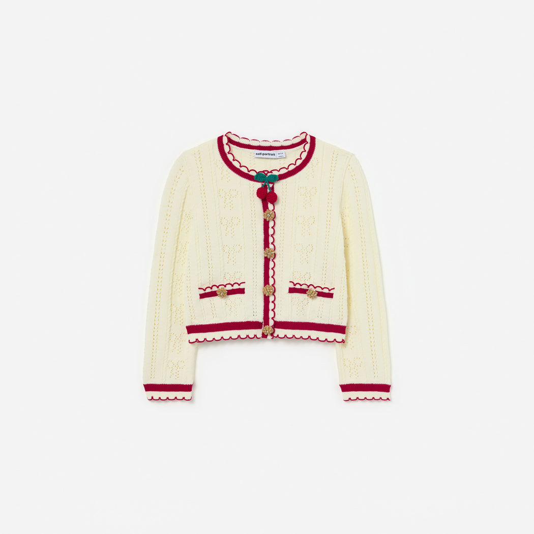 Front view of a girl wearing the Cream Pointelle Knit Stripe Cherry Cardigan