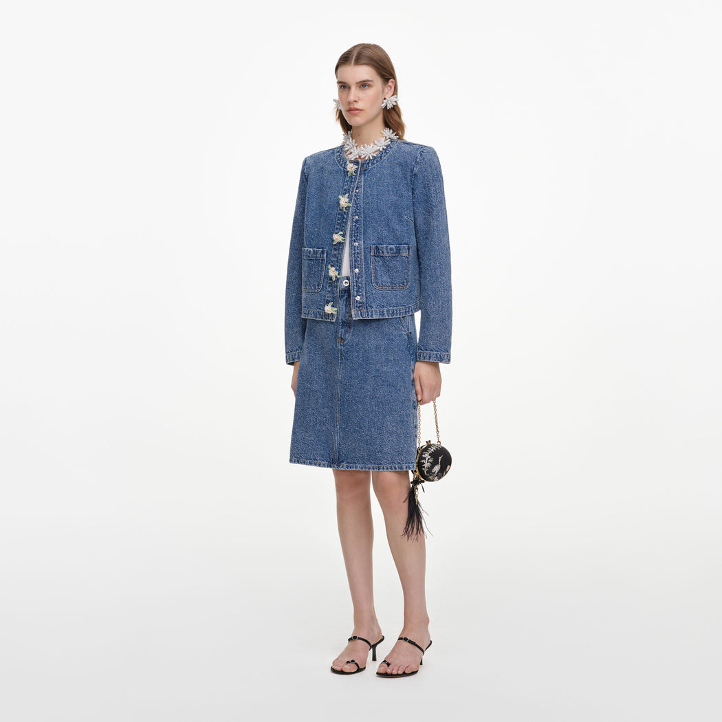Side view of a woman wearing the Textured Denim Mini Skirt