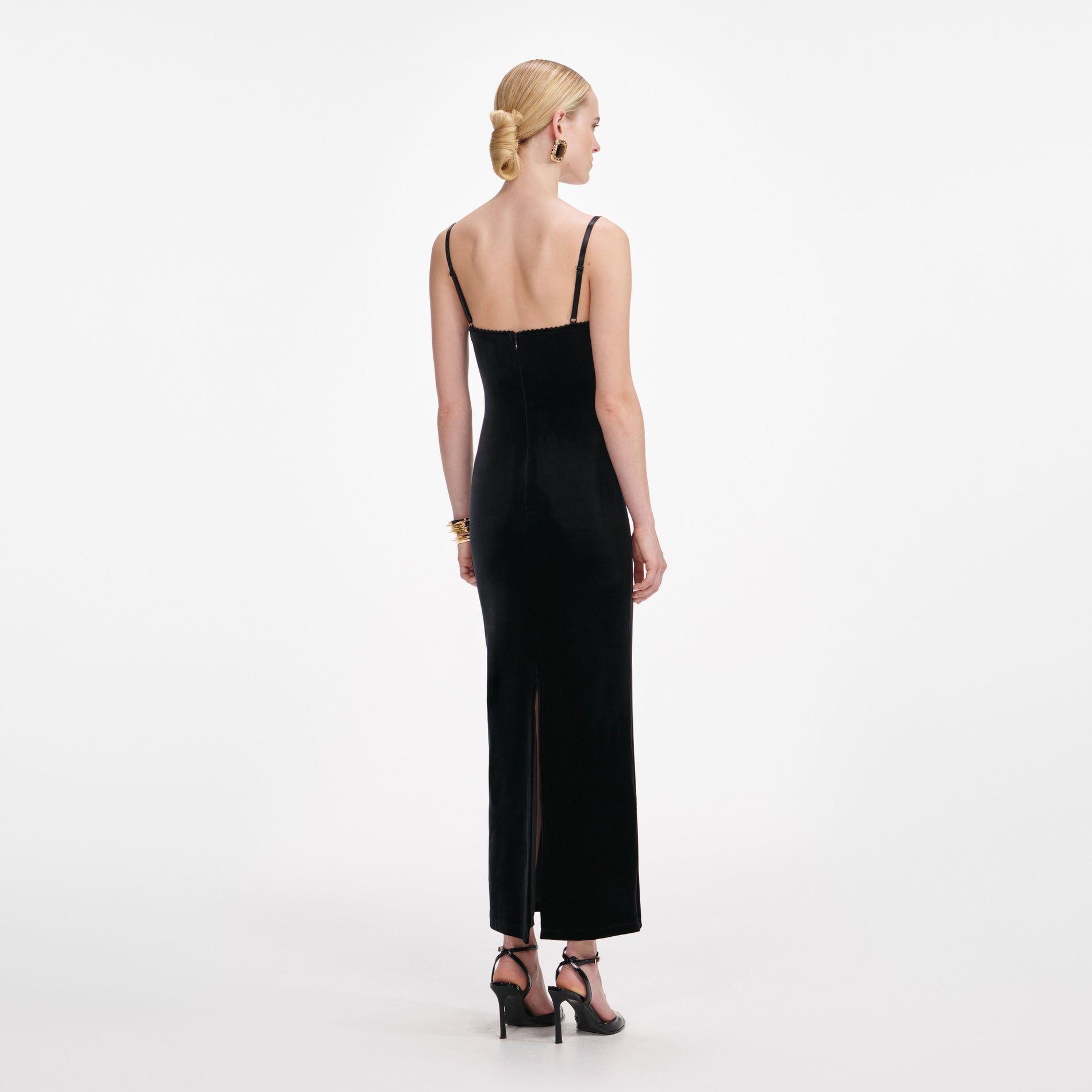 Back view of a woman wearing the Black Velvet Strappy Midi Dress