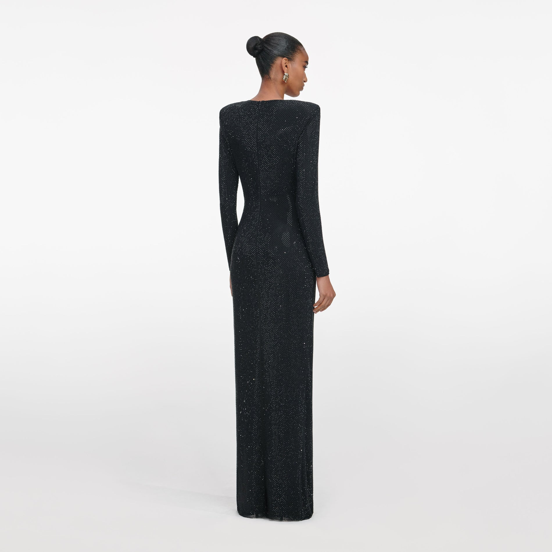 Back view of a woman wearing the Black Rhinestone Embellished Maxi Dress