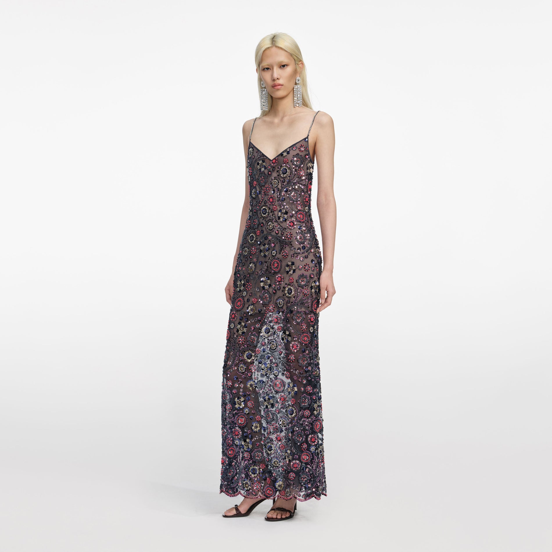 Side view of a woman wearing the Navy Floral Sequin Maxi Dress