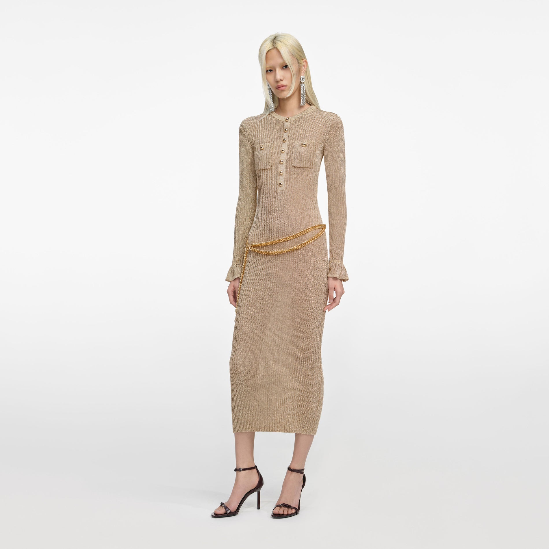Side view of a woman wearing the Gold Lurex Ribbed Knit Midi Dress