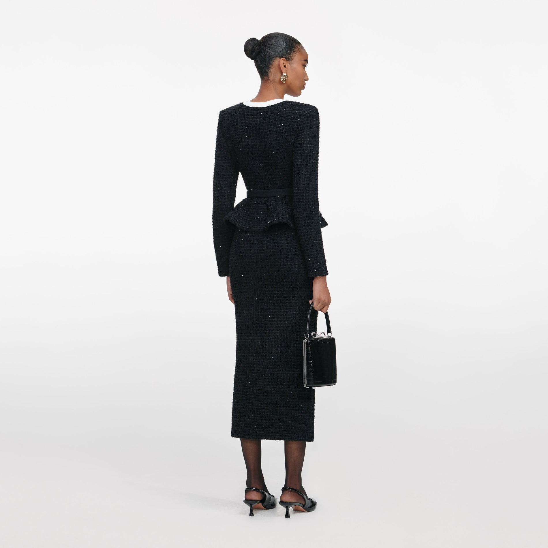 Back view of a woman wearing the Black Floral Textured Knit Midi Dress