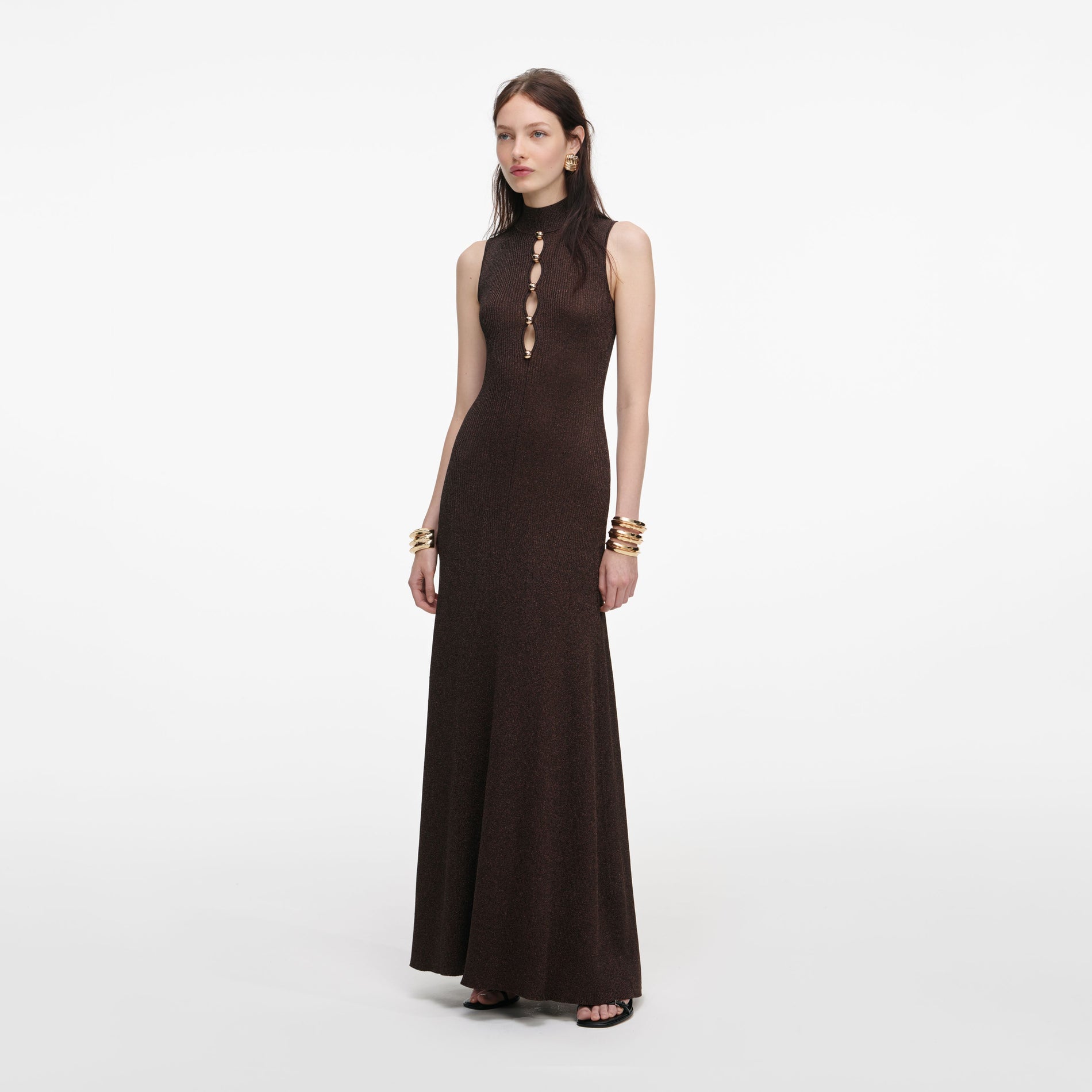 Side view of a woman wearing the Brown Lurex Knit Maxi Dress