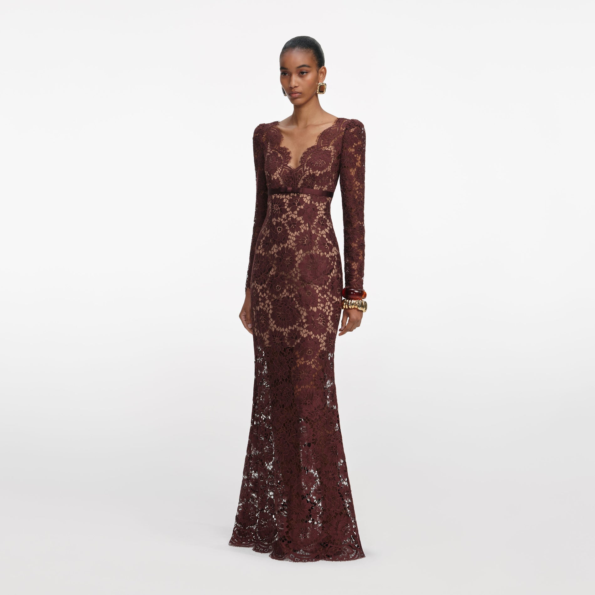 Side view of a woman wearing the Brown Floral Lace Maxi Dress