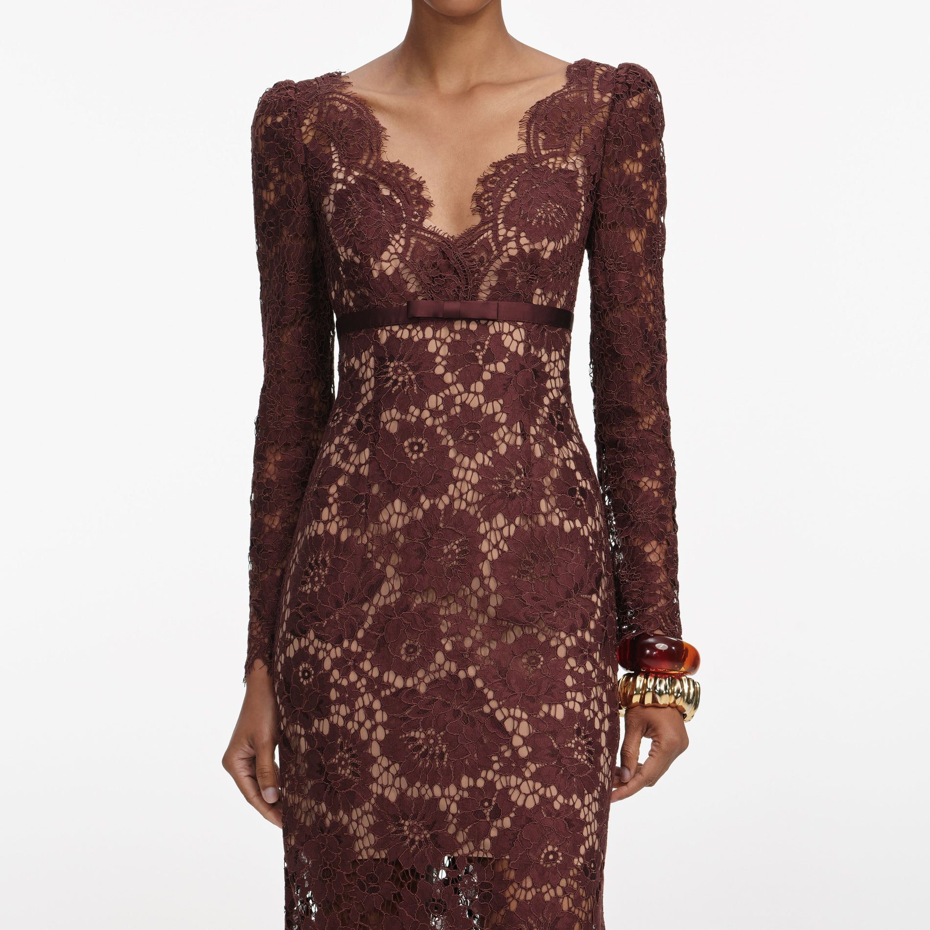 A close up of a woman wearing the Brown Floral Lace Maxi Dress
