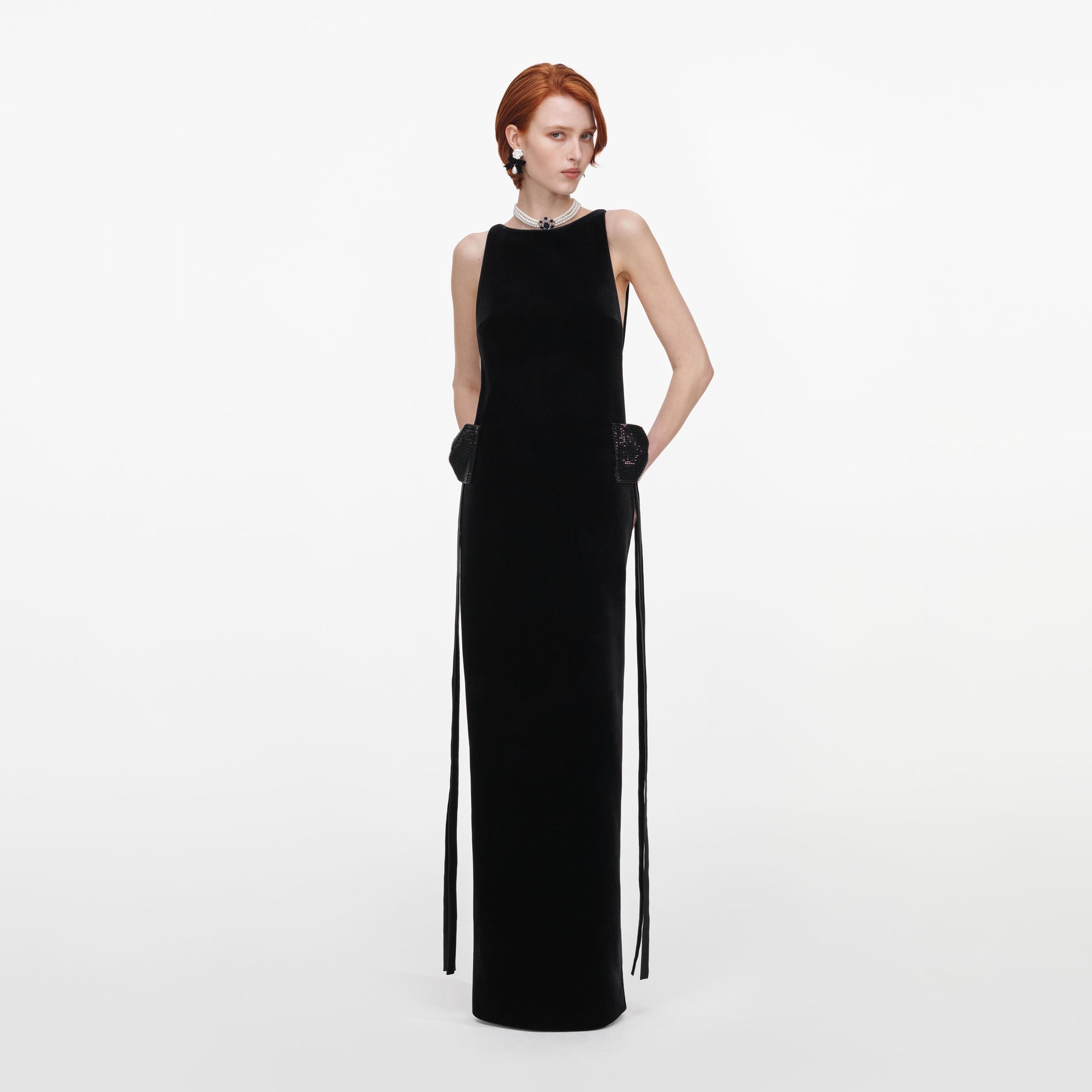 Front view of a woman wearing the Black Velvet Bow Sides Maxi Dress