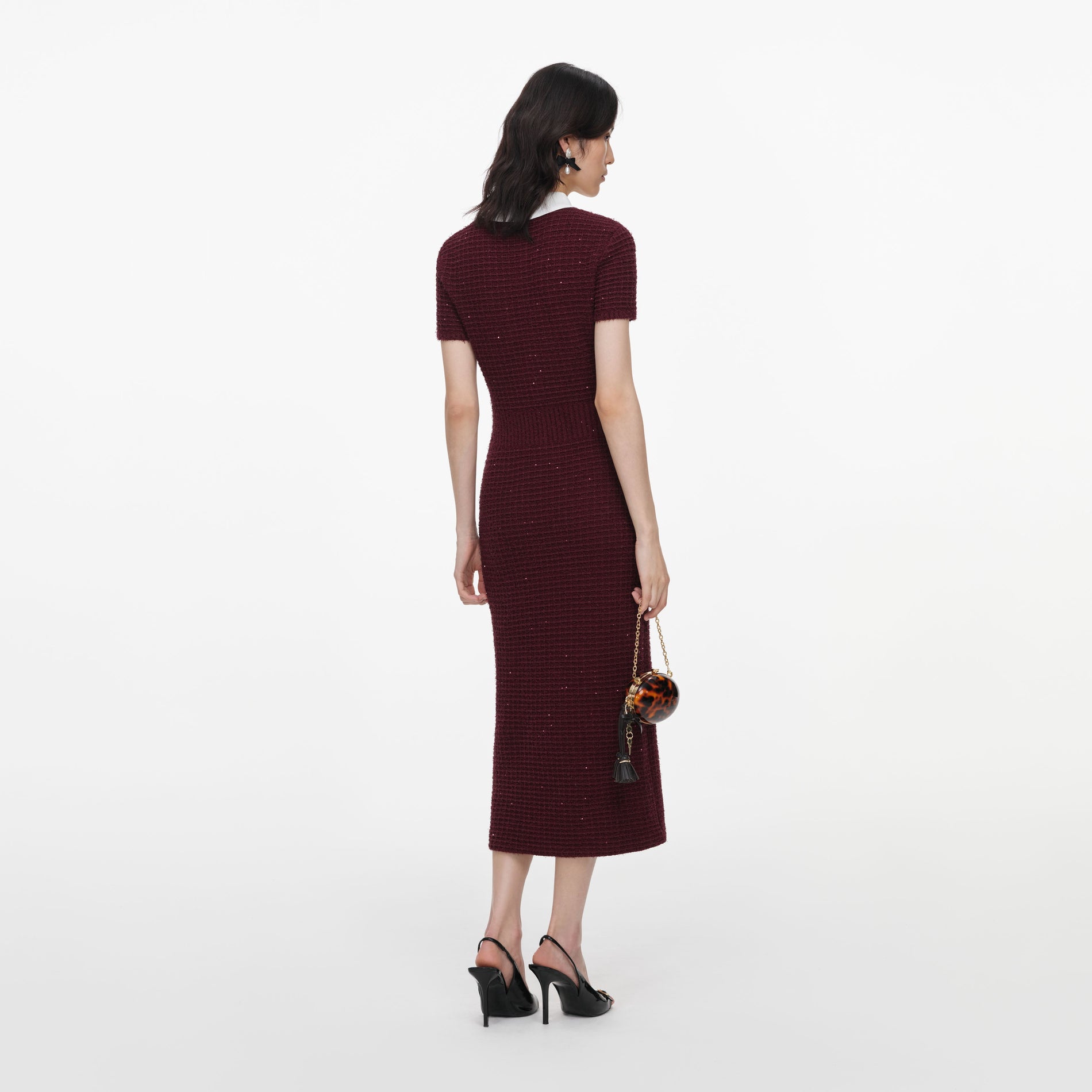 Back view of a woman wearing the Burgundy Textured Knit Midi Dress