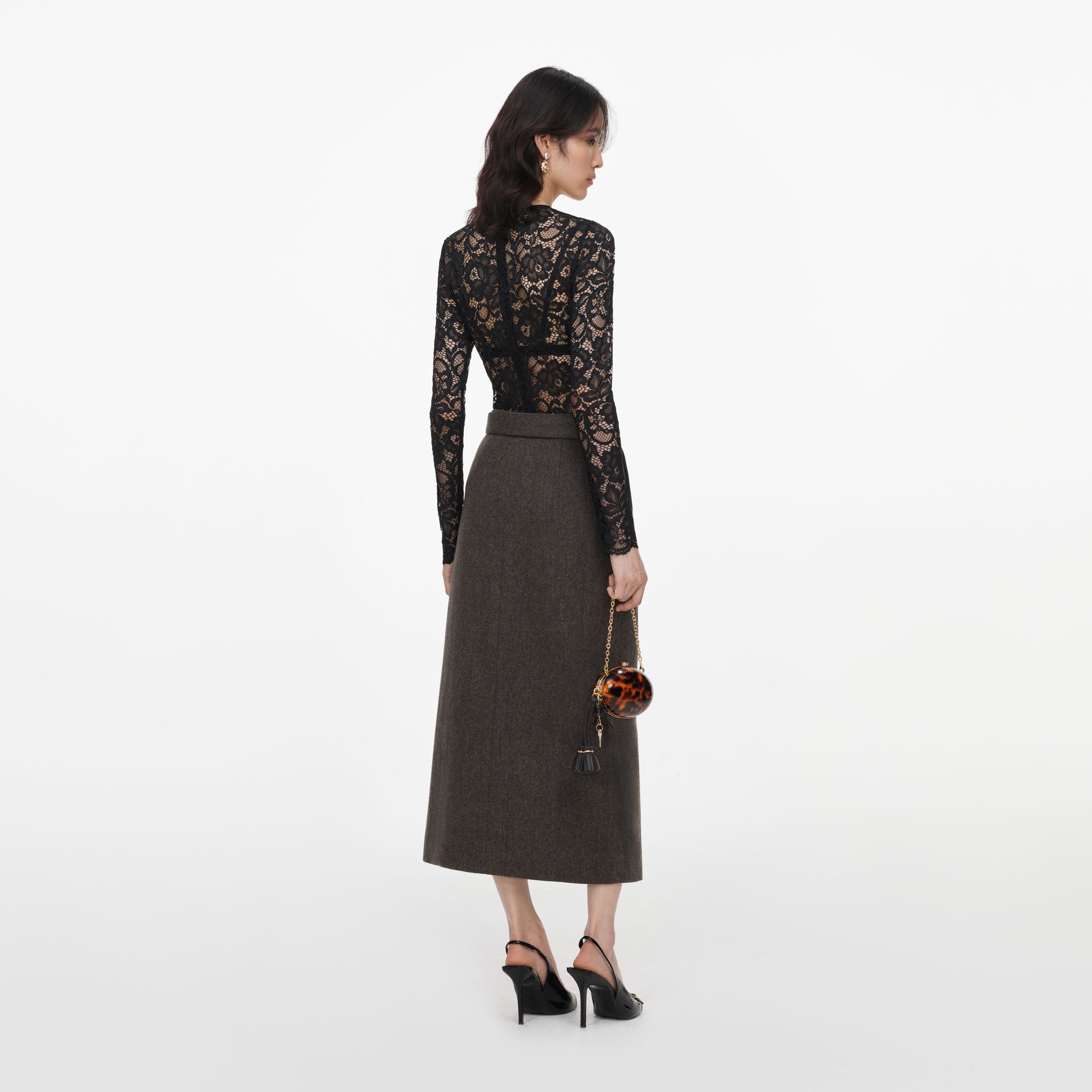 Back view of a woman wearing the Brown Wool Midi Skirt
