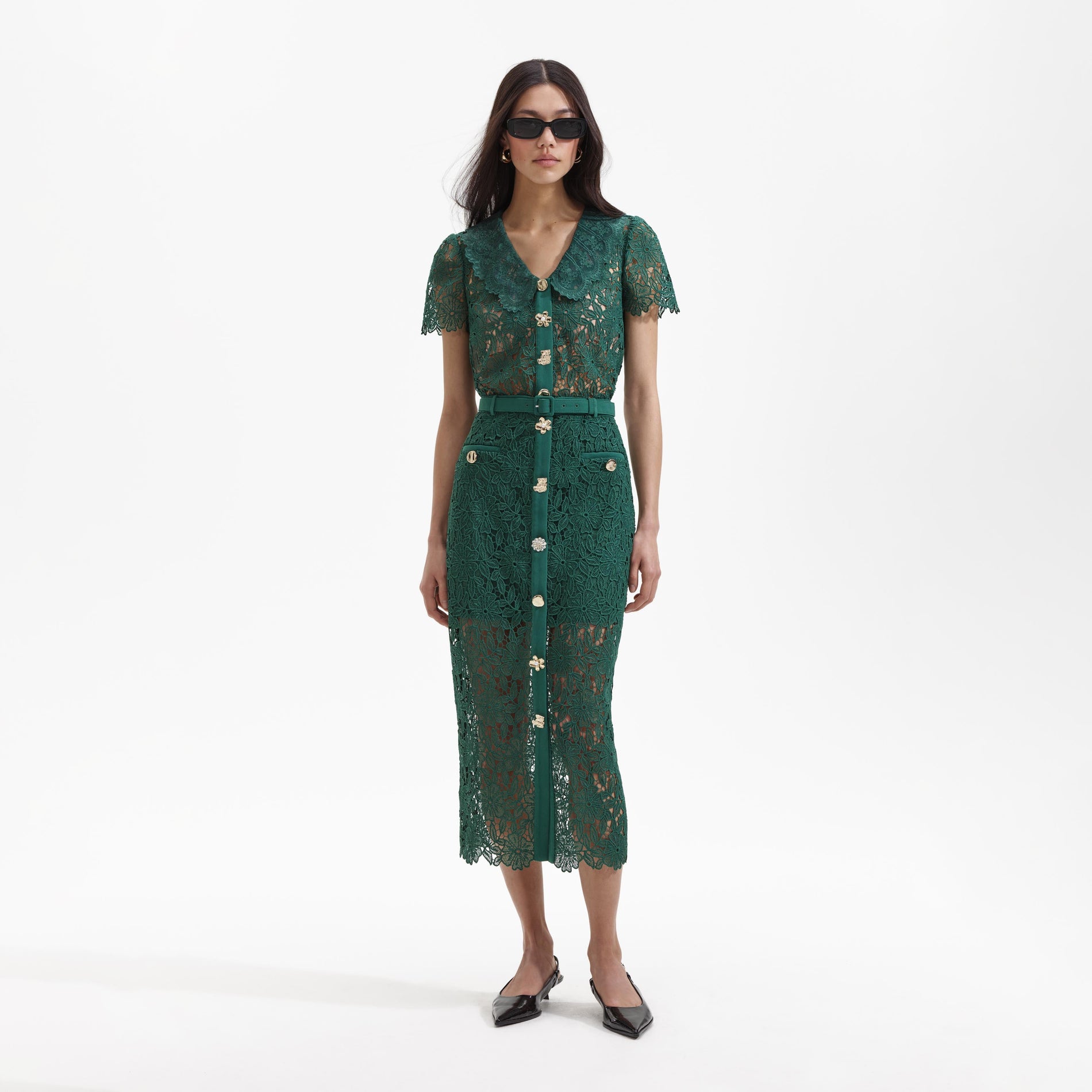 Front view of a woman wearing the Green Guipure Lace Midi Skirt