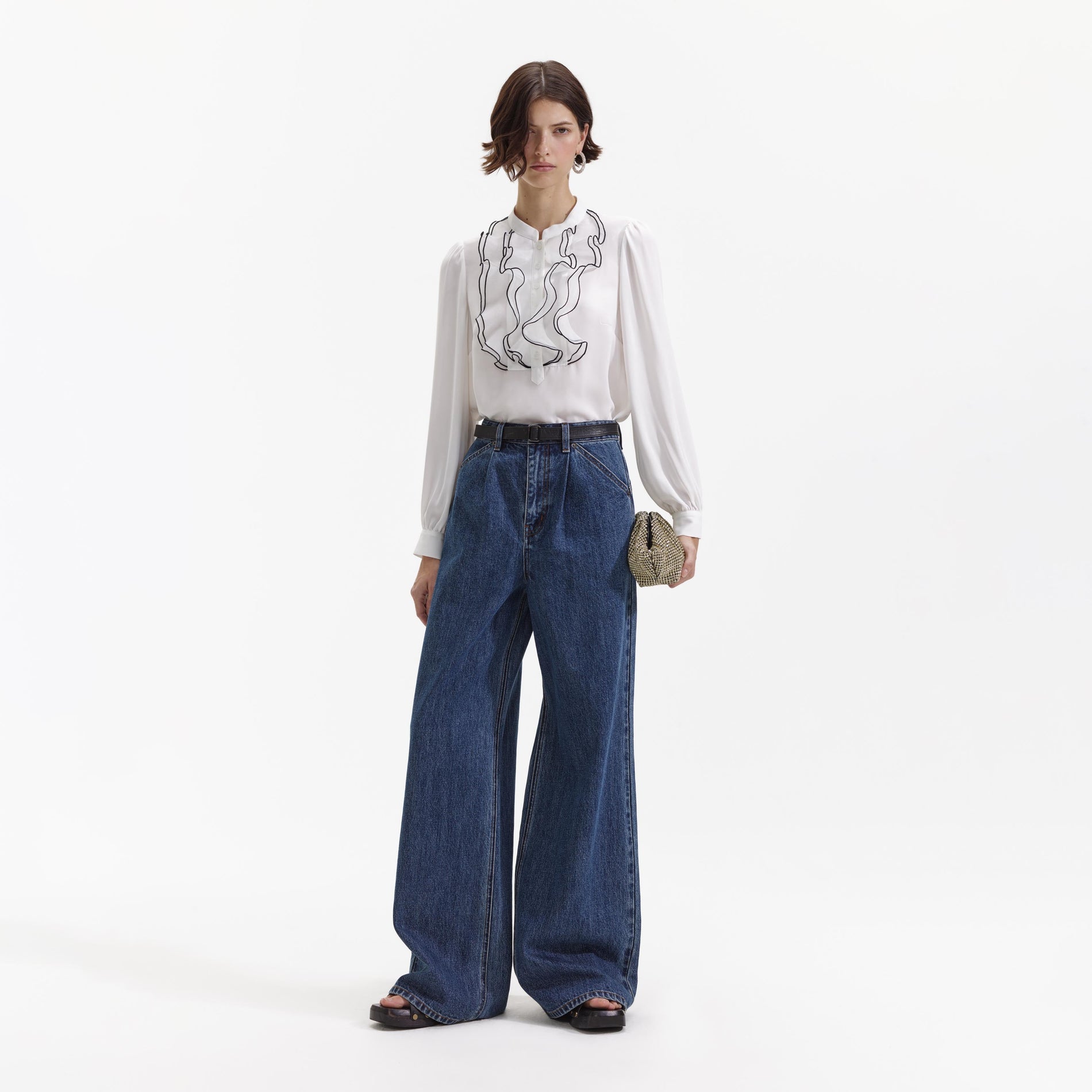 Front view of a woman wearing the Wide Leg Flare Denim Jeans