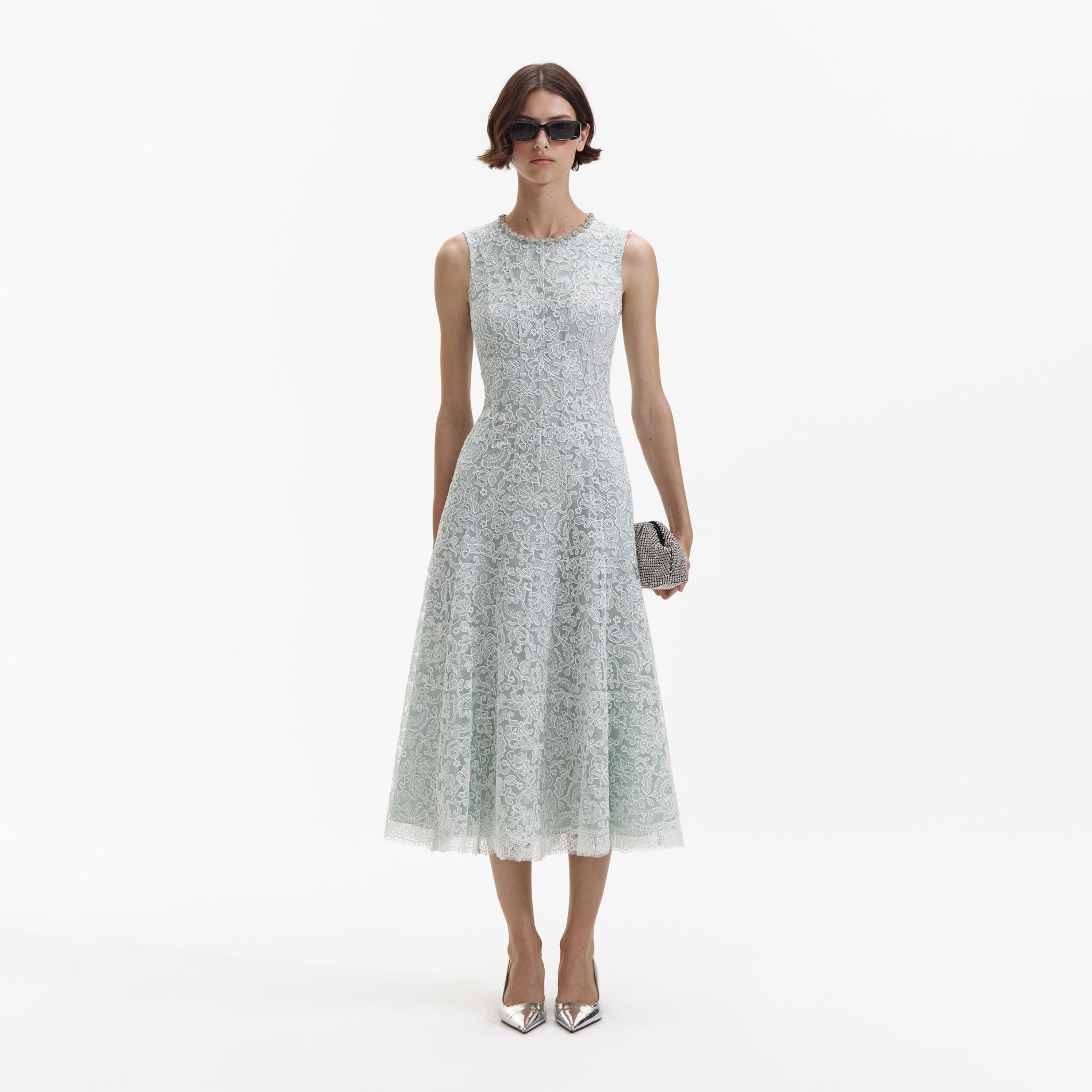 Front view of a woman wearing the Green Cord Lace Round Neck Midi Dress