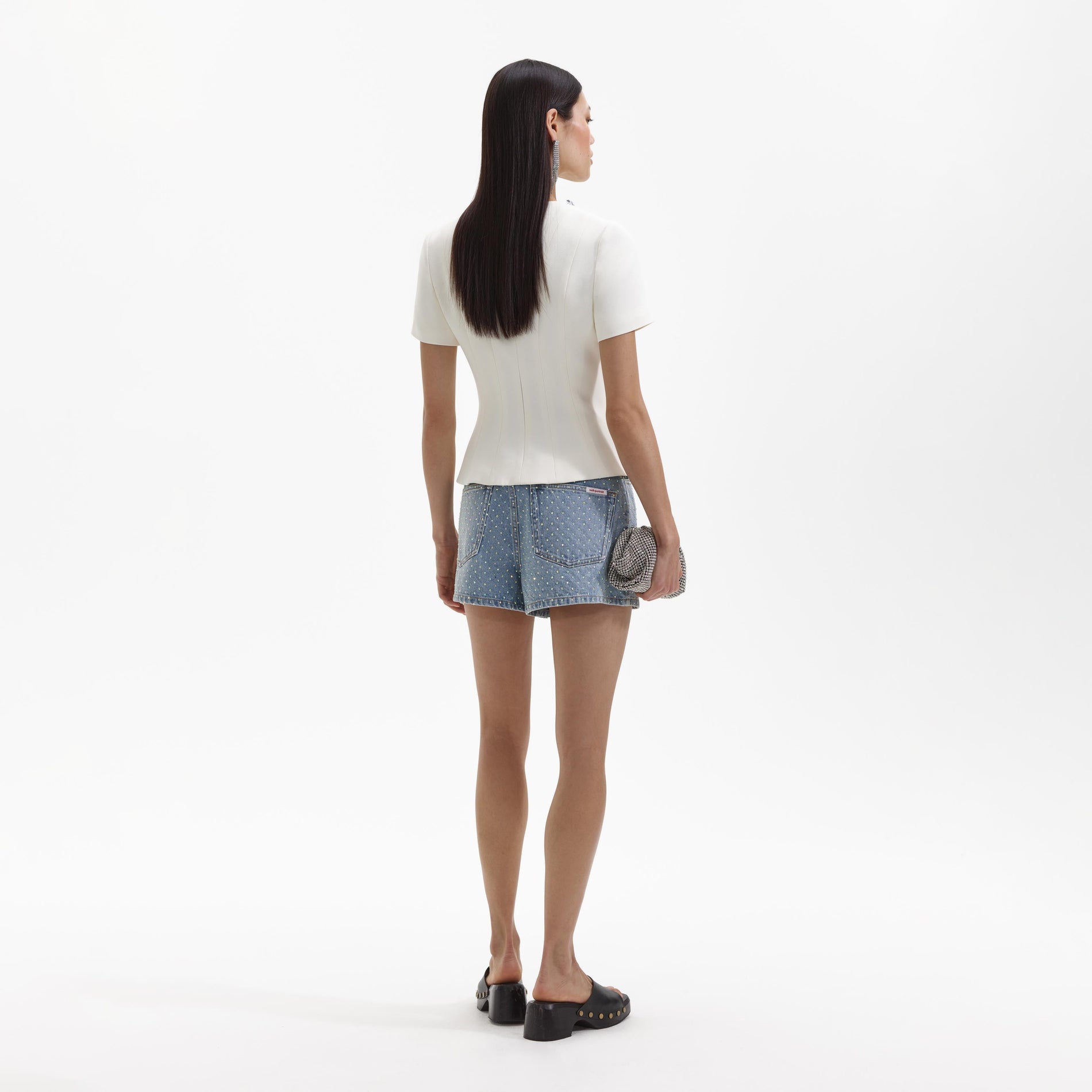 Back view of a woman wearing the Cream Crepe Embellished Top