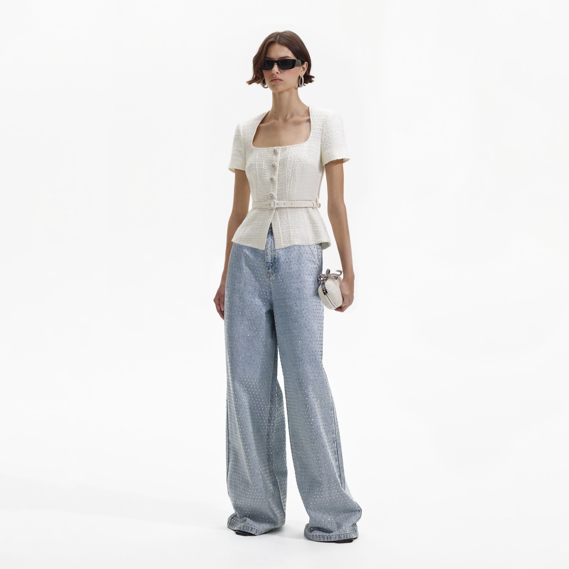 Side view of a woman wearing the Cream Boucle Top