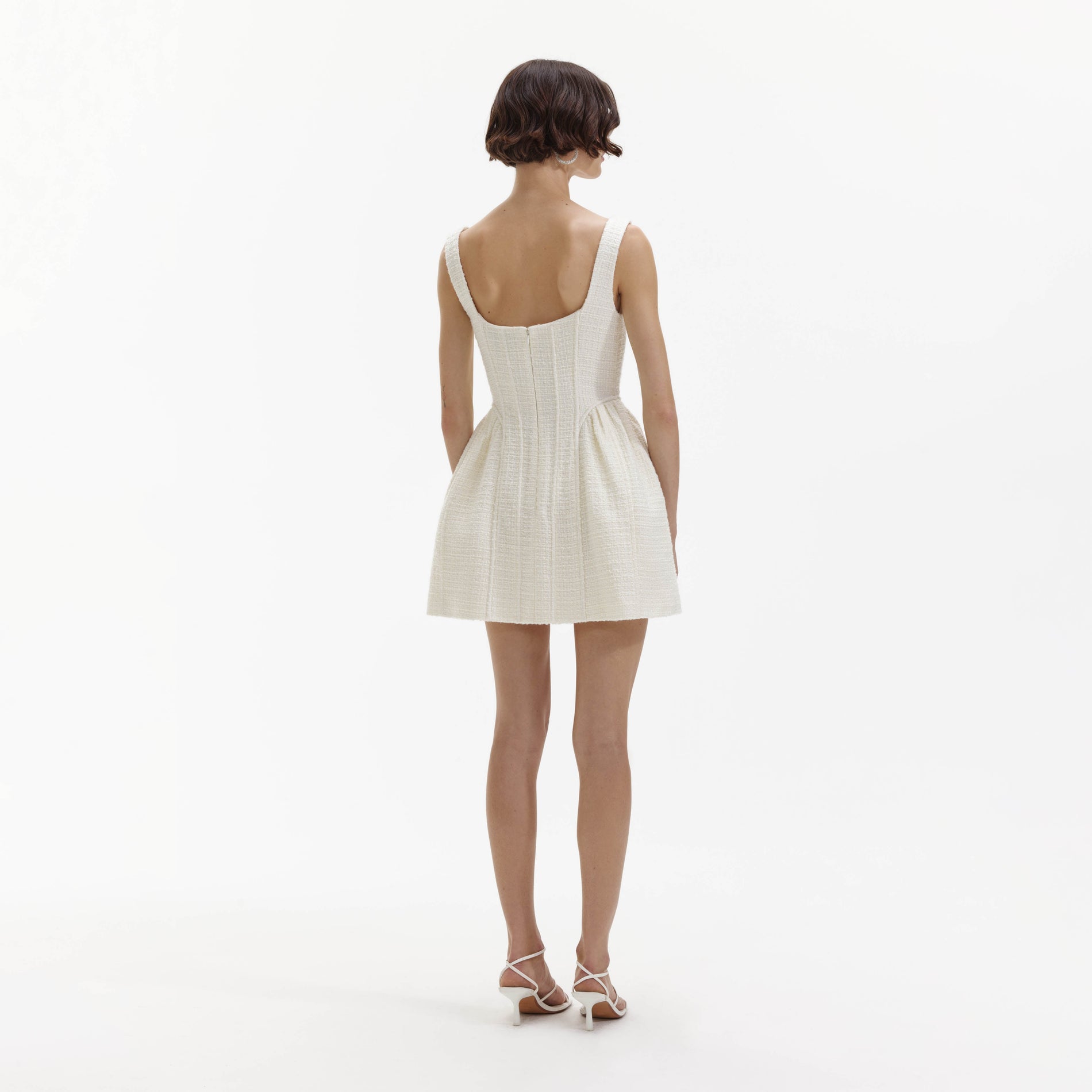 Back view of a woman wearing the Cream Boucle Mini Dress