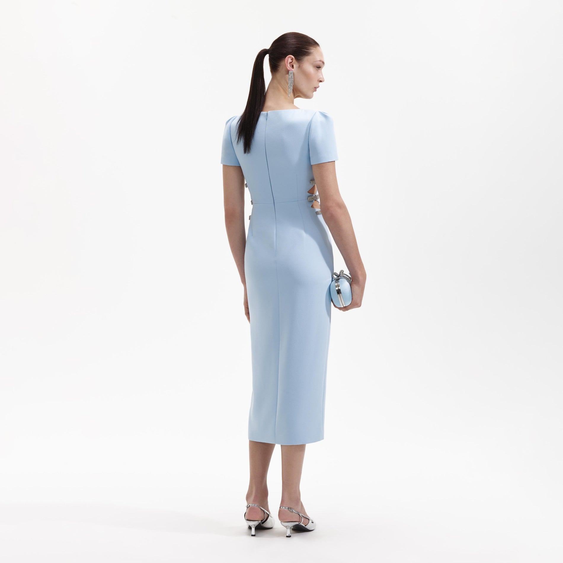 Back view of a woman wearing the Blue Crepe Split Midi Dress