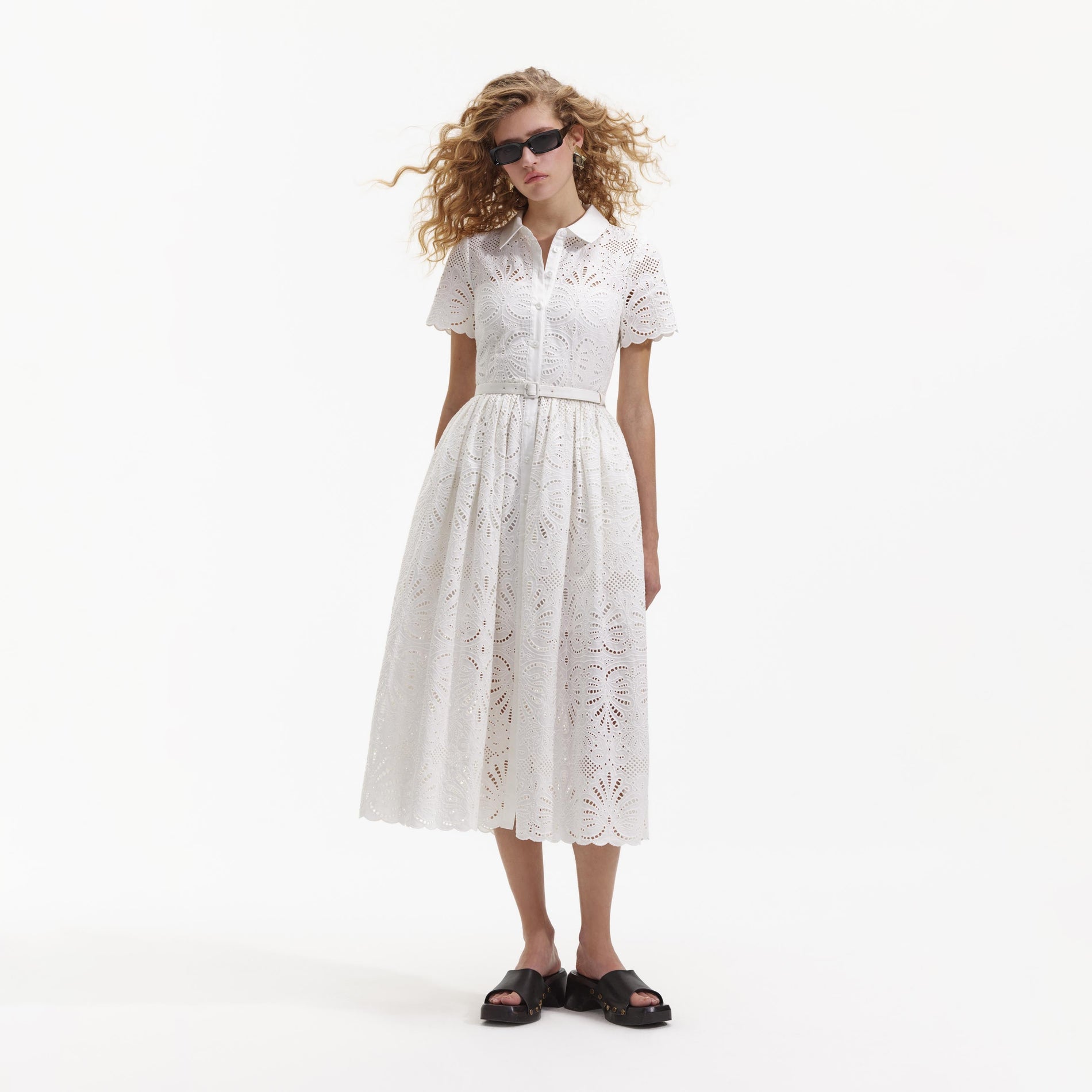 Front view of a woman wearing the White Cotton Embroidery Midi Dress