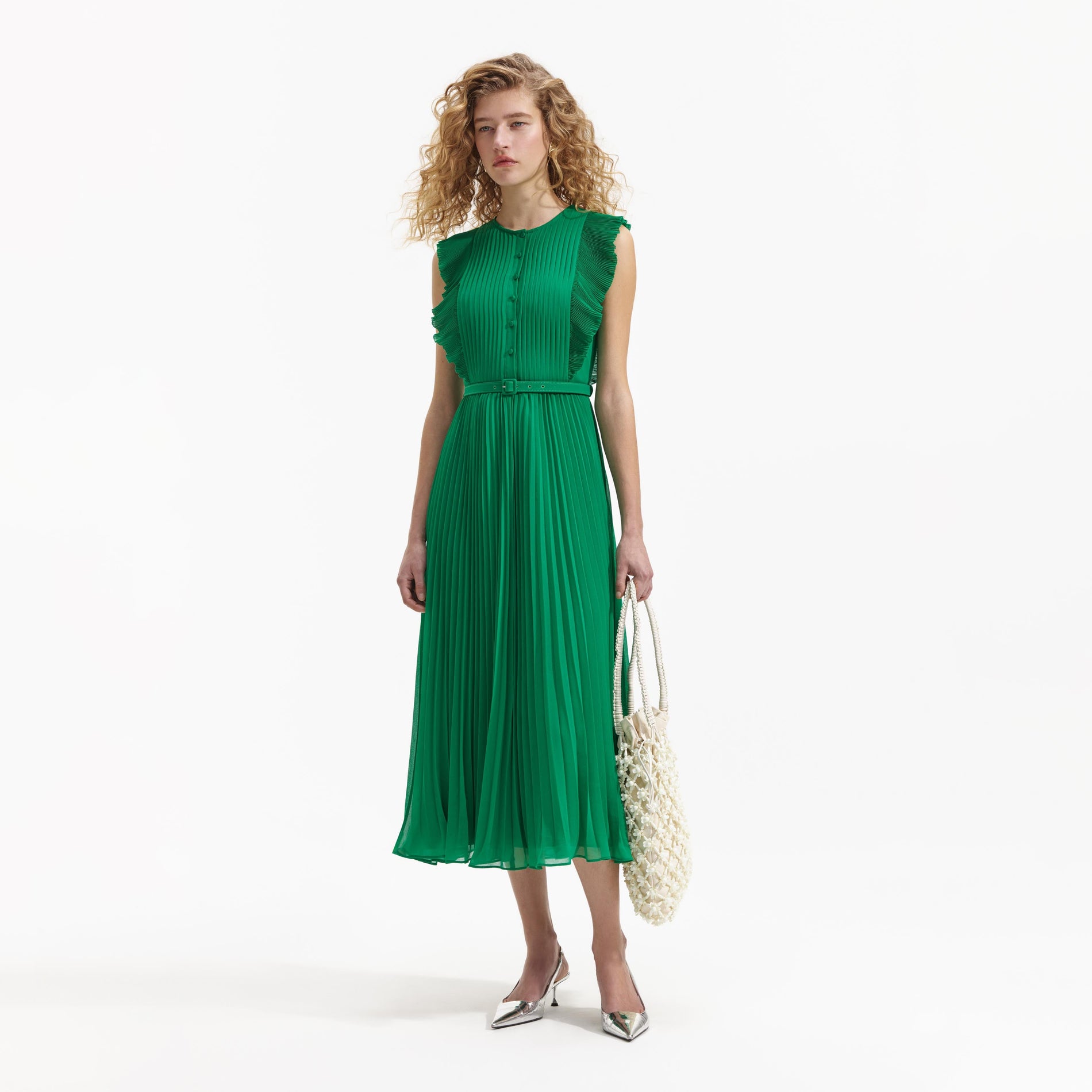 Side view of a woman wearing the Green Chiffon Sleeveless Ruffle Midi Dress