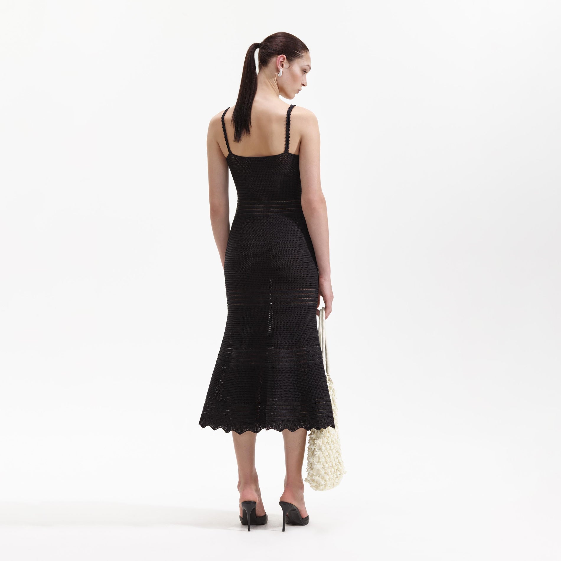Back view of a woman wearing the Black Crochet Cut Out Midi Dress