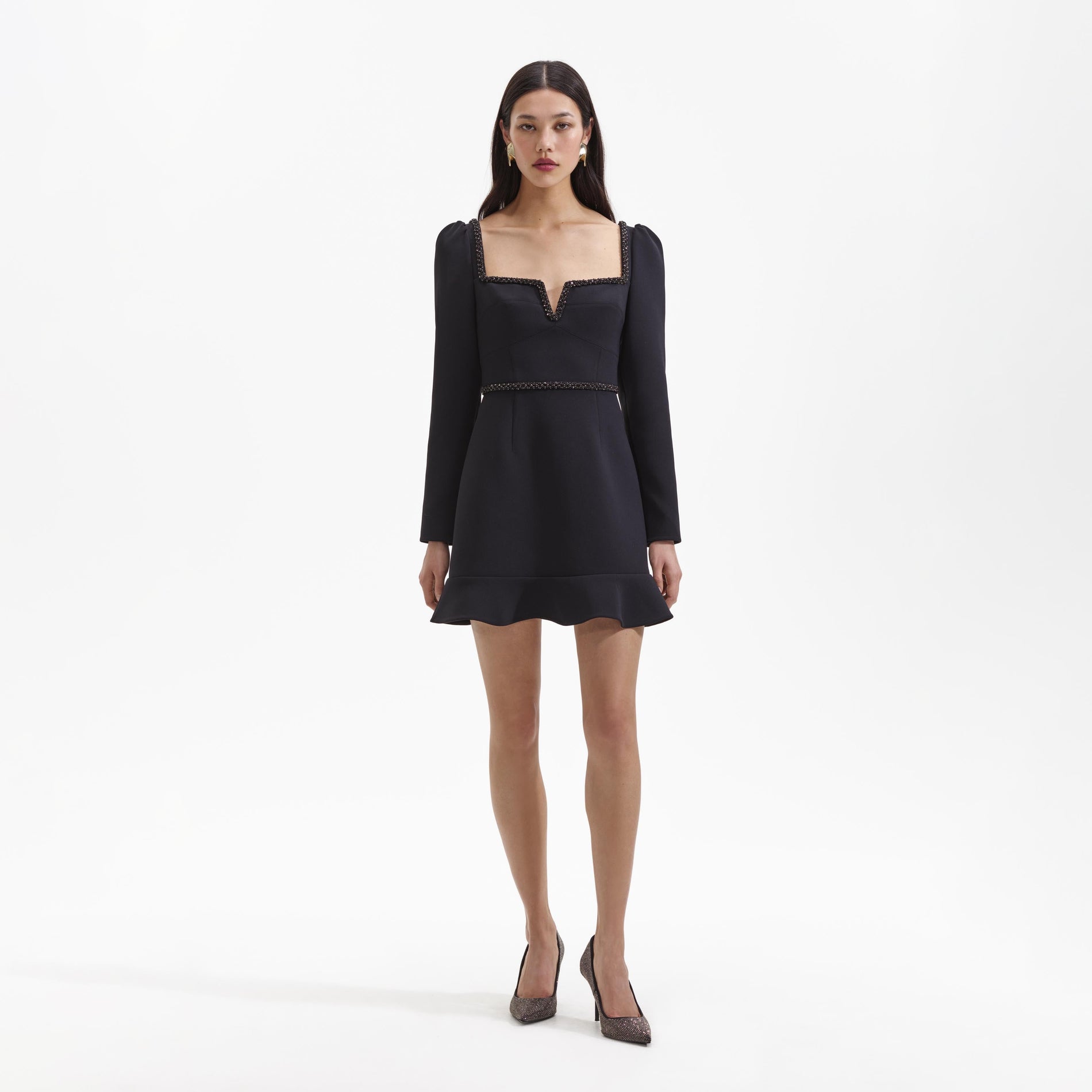 Front view of a woman wearing the Black Bonded Crepe Long Sleeve Mini Dress